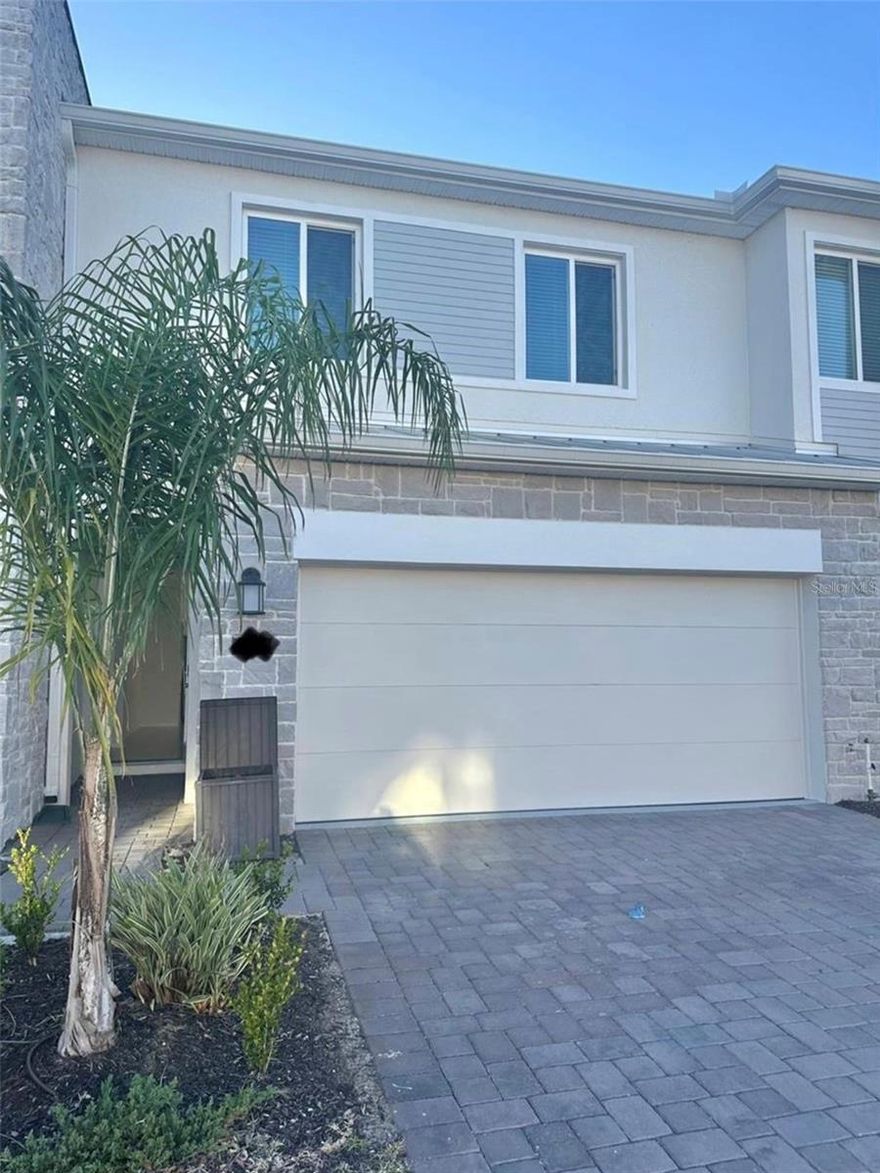 This beautiful and spacious townhome is located in one of Davenport’s most desirable residential-only communities, offering peace, stability, and the comfort of no short-term rentals or frequently changing neighbors. Featuring 3 bedrooms and 2.5 bathrooms, this home shows like a model and is truly move-in ready. The open-concept first floor showcases a bright and inviting living area with quartz countertops, stainless steel appliances, and a seamless flow between the kitchen, dining, and family rooms perfect for both everyday living and entertaining. The epoxy-finished two-car garage and extended driveway provide ample parking. Step outside to your private open patio, ideal for outdoor dining, relaxing, or enjoying Florida’s beautiful weather. Upstairs, the primary suite features an elegant tray ceiling, a spacious walk-in closet, and a luxurious en-suite bathroom complete with dual sinks and a soaking tub. Residents enjoy access to a community pool and playground, with lawn care included in the HOA for low-maintenance living. Conveniently located near schools, restaurants, shopping, and major highways, with easy access to Orlando, Winter Garden, and world-famous attractions, this home perfectly blends location, lifestyle, and value into one exceptional opportunity.