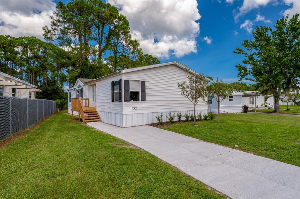 Photo of 13 Lawrence Court, Port Orange, FL 32127 (MLS # V4951303)