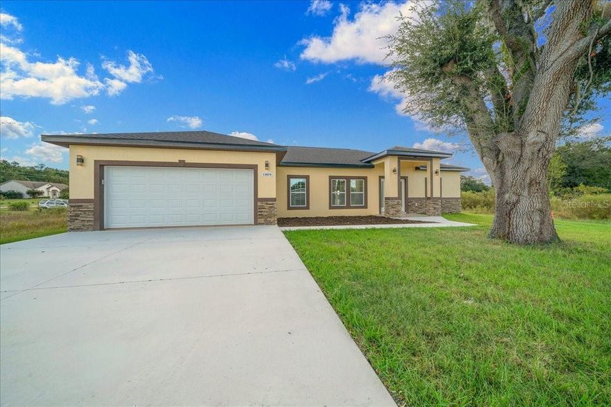 Welcome home to this brand-new construction house built in 2025, offers exceptional quality and thoughtful design spread across 1,818 Sq.Ft. Featuring 3 bedrooms, 2 and a 1/2 bathrooms, and a versatile bonus room, this home was built to exceed expectations. The open floor plan with vaulted ceilings and porcelain tile flooring creates a spacious & elegant feel from the moment you walk in. Kitchen is beautifully appointed with a large center island, 42-inch soft-close cabinets, a walk-in pantry, and quartz countertops that also serve as the backsplash for a seamless look. The primary suite features two walk-in closets and a luxurious ensuite bathroom with double vanities and a custom tile walk-in shower. Split floor plan provides privacy with two additional spacious bedrooms and a full guest bath on the opposite side of the home. The bonus room, located near the half bath and primary bedroom, is ideal for an office, hobby room, or additional bedroom. French doors lead to a tiled rear porch, perfect for relaxing and enjoying the Florida weather. This home is located just minutes from Rainbow Springs State Park, schools, restaurants and stores. For horse lovers the Florida Horse Park is only 17-miles and World Equestrian Center, Ocala is 15-miles away. Designed with attention to detail and modern finishes throughout, this home offers the perfect blend of comfort, style, and convenience. Call us today to schedule a private showing my before it’s too late!