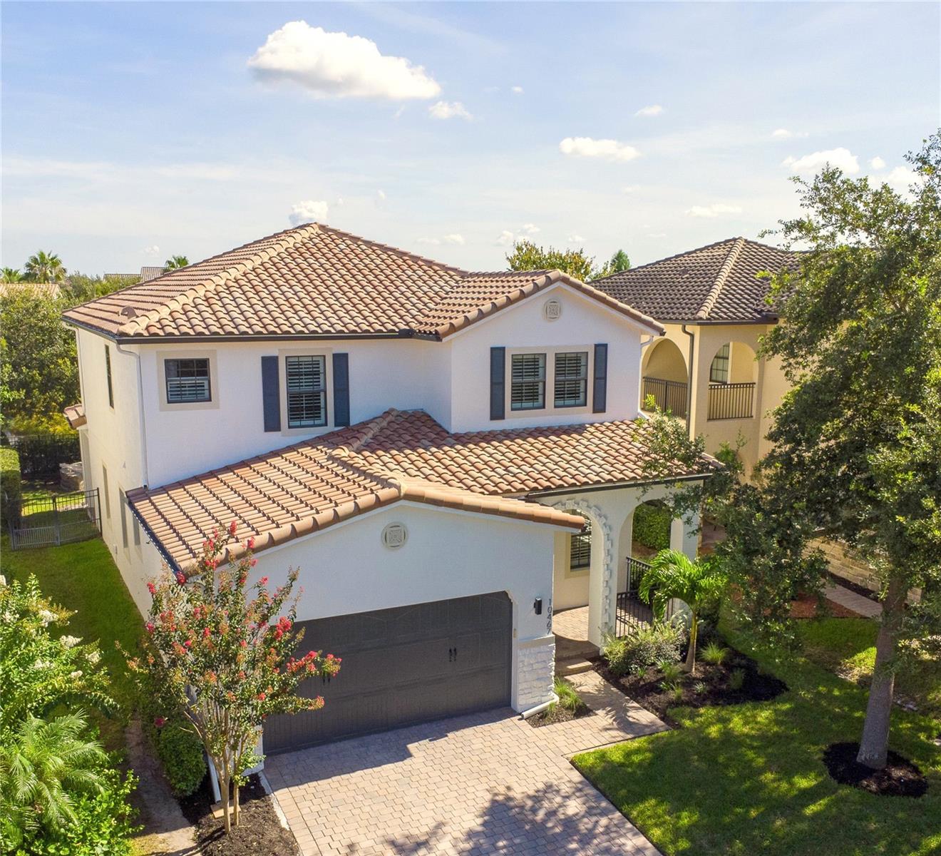 Welcome to this fully renovated, move-in ready masterpiece located within the prestigious guard-gated Eagle Creek golf course community. This custom-designed 5-bedroom, 4-full-bathroom home offers a unique blend of luxury, functionality, and sophisticated style—perfectly suited for modern living and grand entertaining. From the moment you arrive, the welcoming landscaping, quiet street, and curb appeal invite you to stay awhile. Step inside to discover a light-filled, open-concept layout with expansive windows that flood the home with natural sunlight throughout the day. The heart of the home is the gourmet kitchen, featuring premium Samsung appliances, a striking custom range hood, waterfall quartz countertops and backsplash to the ceiling. Whether you're preparing meals for family or hosting guests, this space is designed to impress. Oversized bedroom and full bathroom on the main floor offer ideal flexibility for multi-generational living or a private guest suite. Upstairs, you’ll find all of bedrooms throughout have space to spare. Spa-inspired bathrooms provide comfort and relaxation. Living area is anchored by a beautifully designed fireplace wall, creating a cozy yet refined atmosphere—ideal for intimate evenings or lively gatherings. Step outside to enjoy serene canal water views, all from the peace and privacy of your backyard oasis. New HVAC system, Tesla charging station. Located on a quiet, low-traffic street. Access to Eagle Creek’s premium amenities including golf, clubhouse, fitness center, pools, and more. This one-of-a-kind residence offers the rare opportunity to own a custom, turnkey home in one of the area's most desirable communities. Don’t miss your chance to experience refined Florida living at its finest.