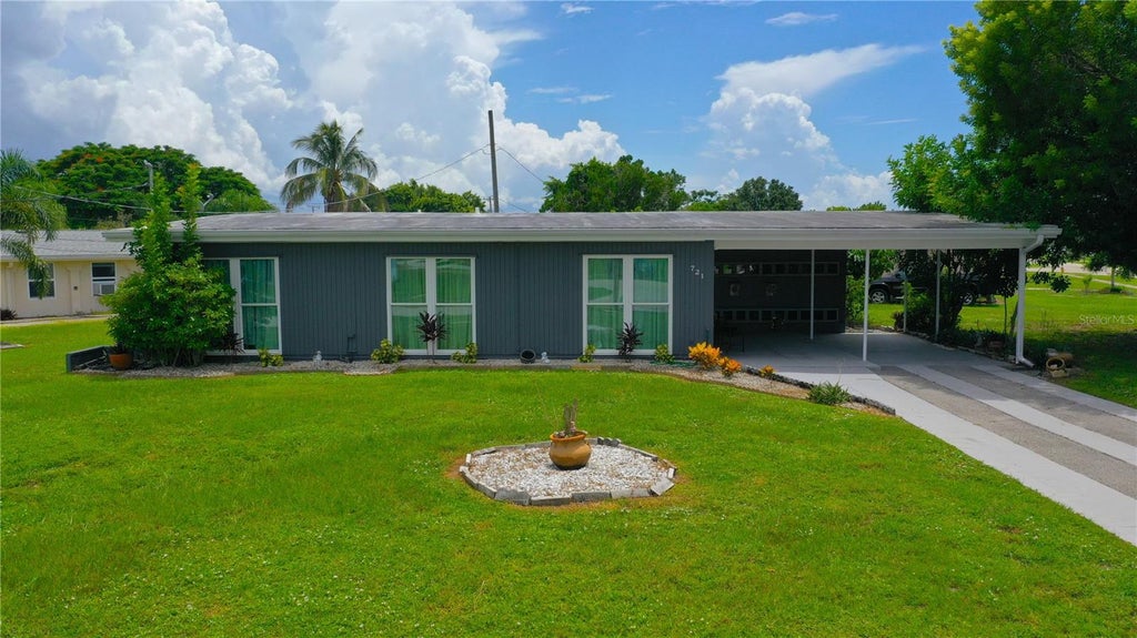 Photo of 721 Sharon Circle, Port Charlotte, FL 33952 (MLS # C7530105)