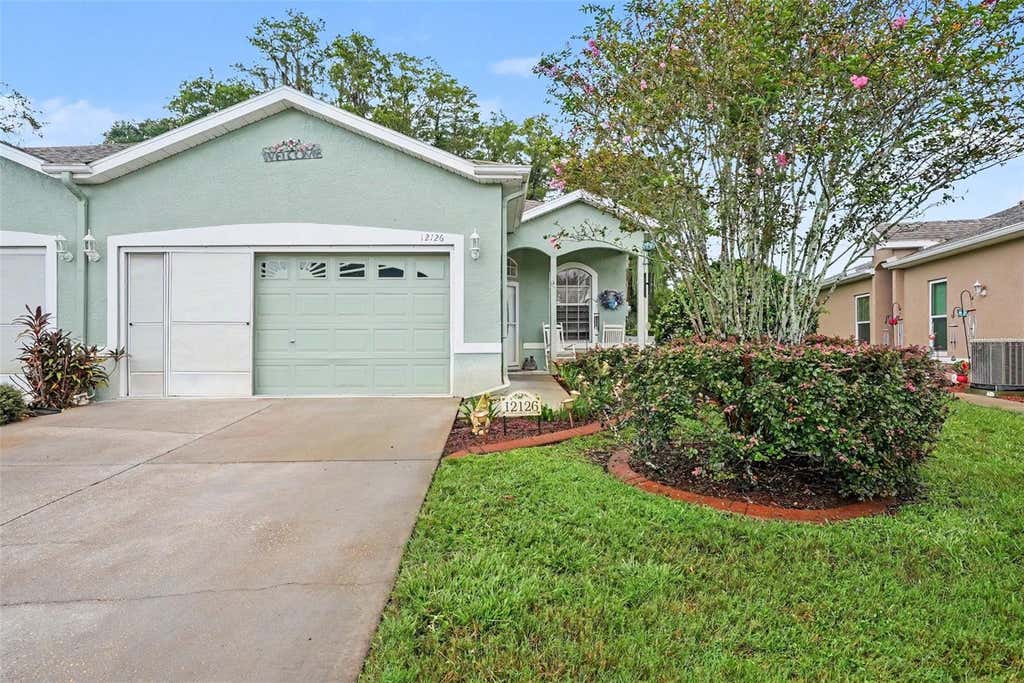 Photo of 12126 Tournament View Ave, New Port Richey, FL 34654 (MLS # TB8542743)