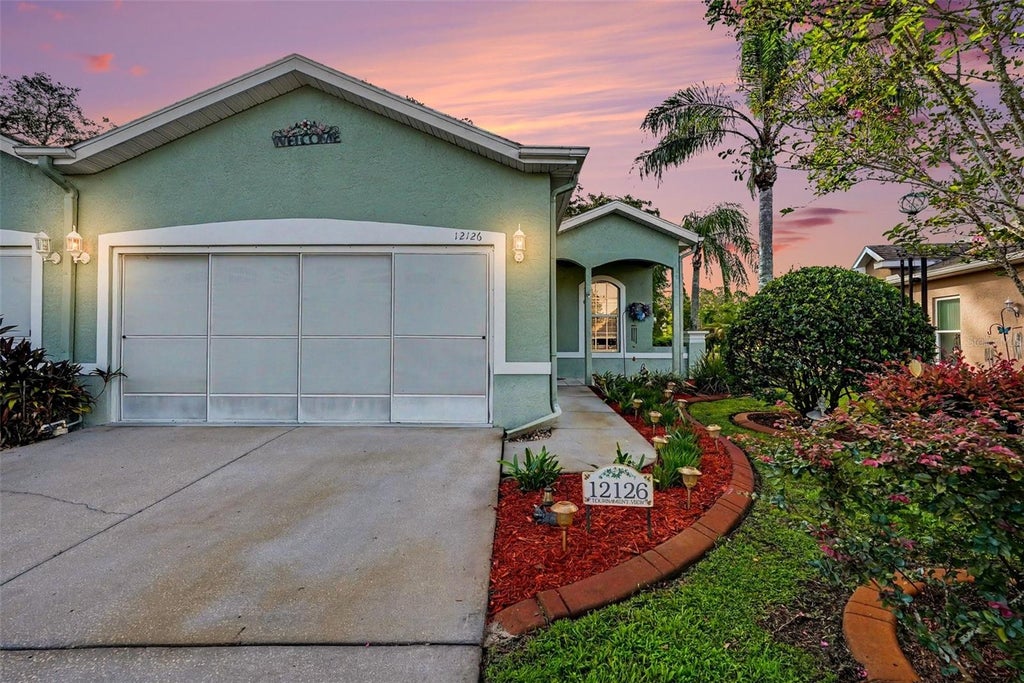 Photo of 12126 Tournament View Ave, New Port Richey, FL 34654 (MLS # TB8542743)