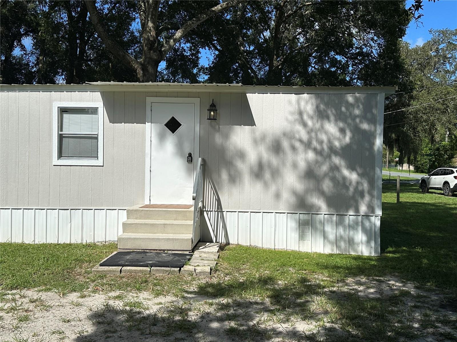 Cozy 2 bedroom single wide with owner financing available. This charming 1983 single wide mobile home offers 2 bedrooms, 1 bathroom, and 672 sq ft of living space. Recently updated with laminate flooring throughout with fresh, neutral paint and sits on a .22-acre lot (no land lease) providing room for outdoor enjoyment. Conveniently located near Belleview and The Villages, you'll have easy access to shopping, dining , and entertainment. Book your private showing today!