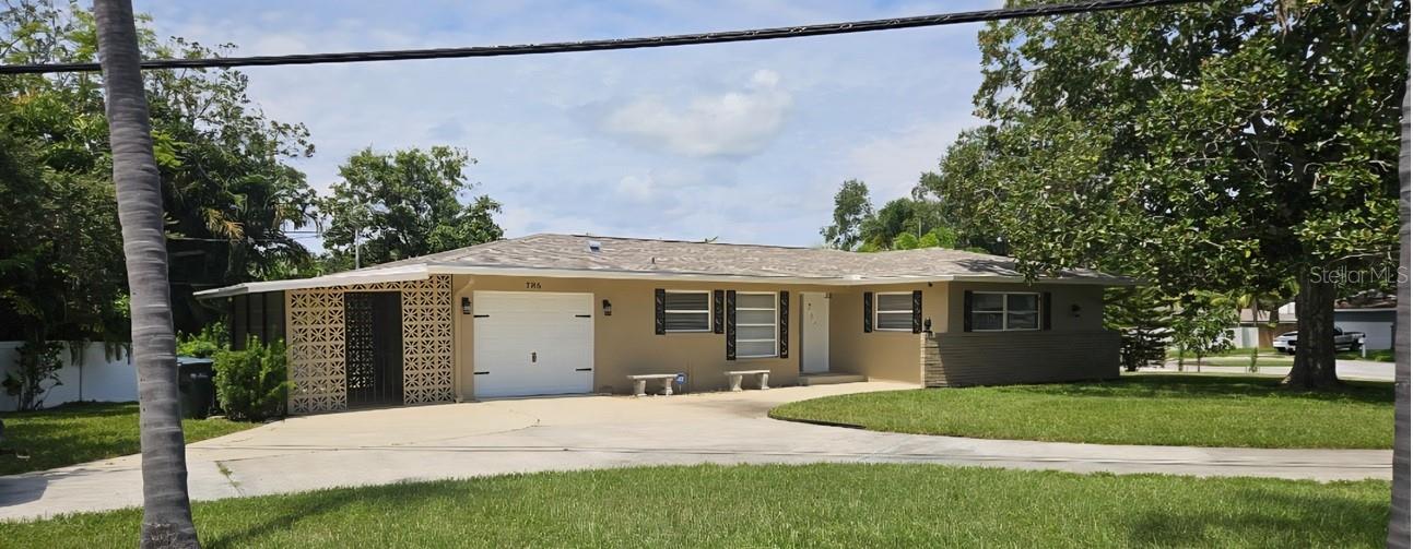 ATTRACTIVE AND IMMACULATE 2 BEDROOM, 2 BATH (PRIMARY BEDROOM HAS PRIVATE BATH), ALSO CIRCULAR DRIVEWAY WITH AN ATTACHED 1 CAR GARAGE AND FLORIDA ROOM. THIS WELL MAINTAINED HOME IS VERY LIGHT AND BRIGHT AND FEATURES NEUTRAL DECOR, NEWER WOOD LOOK VINYL PLANK FLOORING IN LIVING ROOM/DINING ROOM, 18" TILE IN THE KITCHEN, FOYER, HALL AND BATHROOMS, UPDATED COOK TOP, RANGE HOOD, BUILT IN OVEN, WAER HEATER, A/C SYSTEM AND GARAGE DOOR OPENER, WALK IN CLOSETS IN BOTH BEDROOMS. JUST 10 MINUTES TO BEACH, AND MINUTES TO SHOPPING & LARGO MEDICAL CENTER.