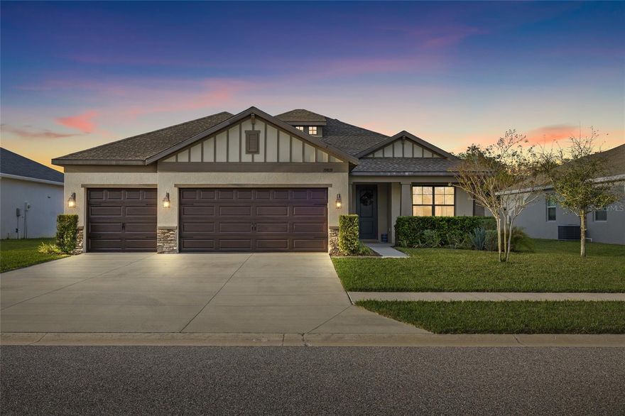 Welcome to Preservation at Pasco County in the heart of Lutz. This beautifully maintained home offers a desirable open floor plan with abundant natural light and well-designed living spaces, ideal for both everyday living and entertaining. The spacious living and dining areas flow seamlessly, creating a comfortable and functional layout.

The kitchen features ample cabinetry, generous counter space, and a convenient layout that opens to the main living areas—perfect for hosting or day-to-day use. The primary suite offers a private retreat with an en-suite bathroom and walk-in closet. Additional bedrooms provide flexibility for guests, a home office, or growing needs.

Step outside to a fully fenced backyard, offering space for outdoor enjoyment, pets, or future customization. The covered patio area is ideal for relaxing or entertaining. A 3-car garage provides ample room for parking, storage, or a workshop.
Additional features may include modern finishes, indoor laundry, and ample storage throughout.

Located in a well-maintained community with convenient access to top-rated schools, shopping, dining, and major roadways, allowing for an easy commute to Tampa and surrounding areas.
Whether you're a first-time buyer, growing family, or looking to downsize without sacrificing comfort—this home checks all the boxes.