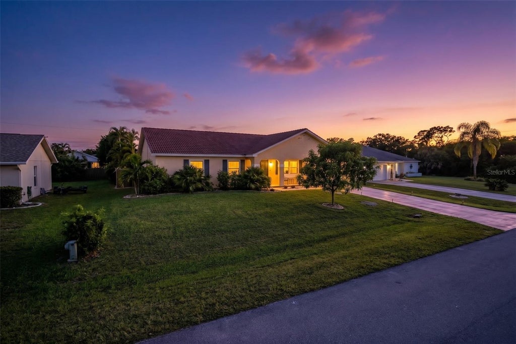 Photo of 9371 Heartwellville Avenue, Englewood, FL 34224 (MLS # C7530706)