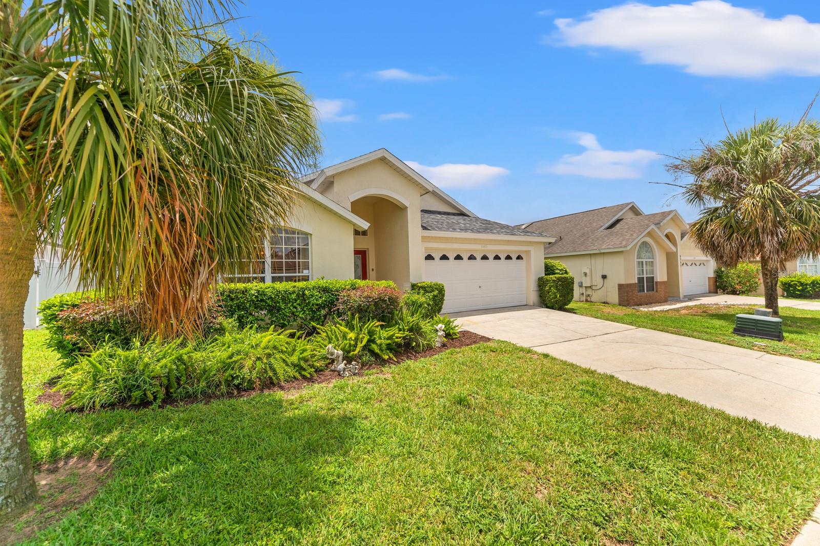 Spacious and versatile pool home located minutes from Disney in a desirable community setting with no HOA. Featuring two master suites it’s perfect for vacation use, short-term rental investment, or full-time Florida living. Step inside through the bright entrance foyer, featuring a tiled floor, transom window, and decorative niche. The home offers 5 bedrooms and 4 bathrooms, thoughtfully laid out with multiple ensuite options, making it ideal for multi-generational living or hosting guests. The front ensuite bedroom features its own private bath with a tub/shower combo and natural light. Two additional themed bedrooms—“Donald & Daffy Duck” and “Harry Potter”—share a family bathroom, while two master suites provide direct access to the screened lanai and pool area. The primary master retreat boasts a garden tub, walk-in shower, dual sinks, and a spacious walk-in closet. The heart of the home is the open kitchen with island, stainless steel refrigerator, glass-top stove, and adjoining dinette. A separate dining room with skylight and decorative archway leads into the expansive living room (23x15), featuring skylights, double sliding doors to the patio, and custom built-in shelving. The garage has been converted into a Simpson-themed games room with pool table & foosball. Outdoors, enjoy Florida living at its best with a covered lanai, sparkling pool, and spa, all partially fenced for privacy. New roof June 2025, exterior paint June 2025, hot water tank 2021, A/C 2020, pool surface 2020 this fully furnished home is turn-key ready for rental or just bring your toothbrush and call it home.