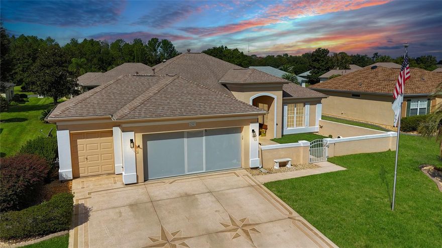 A house of this caliber does not hit the market often.  This was meant to be their dream home but times have changed so make it your dream home.  This one checks many of the boxes for "wants & needs" for many buyers.  Upgrades galore!  Great curb appeal.  The courtyard is great for entertaining and very dog friendly.  This home is concrete block and stucco and features both a breakfast nook and formal dining should you desire to have that or with this open floor plan...flex the space however you need/want it.  All of the flooring has been replaced with matching LVP throughout.  Designer remote ceiling fans throughout.  Interior recently painted including trim.  Window treatments are Plantation Shutters or custom cellular blinds.  The kitchen has granite counter tops with tile backsplash.  Newer stainless steel appliances (microwave 11/2025), closet pantry, island, breakfast bar and a nook overlooking the courtyard.  The living room/dining room combo is a great space and a stone electric fireplace with custom bookcases has been added for storage and memorabilia.  Another exciting feature is that the lanai has been enclosed with glass windows, a mini split for climate control and also feature the LVP flooring.  Talk about a great "Man Cave" and  adds another 384 square feet to the living area that is not reflected in the Marion County property appraiser's website.   Does football parties come to mind?  The summer kitchen complete with mini fridge and gas and charcoal grills with awnings is right outside the door.  The primary suite is huge so if you are looking for space, this is the home for you.  It also features a bay window with custom bench storage and a door that leads to the lanai.  Primary bath has been completely redone and has a wheelchair accessible  shower so not only beautiful but functional.  The guest bedroom and bath are sure to delight even the pickiest visitors.  A den is located off of the entry way and boasts French doors for privacy.  Inside laundry room with storage cabinetry.  Extended garage with golf cart bay with privacy screen with built-in door for the 2-car garage, newer garage door openers, deep utility sink and pull-down storage.   HVAC 2018, Shingles 2021, re-piping in attic June 2020. Irrigation well on this property shared with neighbors.  This home is located in the award winning gated community of Del Webb's Spruce Creek Golf and Country Club.  It features 4 - 9 holes golf courses, 3 pools, softball field, Veterans Memorial, outdoor pavilion, bocce ball, pickleball and tennis and numerous clubs and other activities.  Make it home today