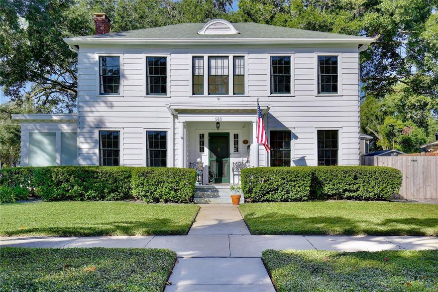 Welcome to 918 S. Palmetto Avenue! This 1921 Colonial Revival home is located on a large corner lot in Historic Downtown Sanford’s Residential Historic District. Featuring 3 bedrooms, 2 1/2 bathrooms + 2 flex rooms, this home also has a 600+ sq. ft., 2-car detached garage (new garage door doors with openers, 2025). This home has been thoughtfully renovated over the last decade, and the end result is a beautiful home that is also COMFORTABLE and FUNCTIONAL for modern day living. As you enter the home's foyer you'll notice the stately staircase, the centerpiece of the traditional Center Hall Colonial floor plan. The dining room and kitchen have been updated to an open floor plan, with a Carrera marble peninsula-style countertop, traditional white cabinetry, stainless steel appliances (natural gas range) and subway tile back splash. This kitchen features 3 pantries, one of which is currently used as a party closet! Around the corner is a nook/bar area, followed by the mud porch, and downstairs powder bath. The large living room features 4 large windows, a decorative brick fireplace, a custom built-in bookcase (2017), custom draperies, and 2 French doors leading to a sunroom/flex room/office. Hardwired ceiling speakers are located throughout the downstairs of the home - so great for entertaining! Beyond the living room is a downstairs sunroom/flex room/office, filled with windows that make it a light and bright space - perfect for an office or den. Upstairs, surrounding a large and open upstairs landing, you'll find the large primary suite, two additional bedrooms, large full bathroom with double sink vanity sink, and upstairs laundry room. A small yet magical room is found at the top of the stairs - a flex room, perfect for a small office, nursery, meditation/yoga retreat, reading nook...the big primary suite features three large double-hung windows, as well as a wall of custom closets installed by Closet by Design (2024). Walking into the classic en suite bathroom is like stepping into a relaxing spa, featuring Carrera marble tile, an antique cast iron claw foot tub, windows, amazing natural light, double sink vanity, and plenty of spaces to store everything neatly. The nearly .25 acre corner lot also features a private wood-fenced (2024) backyard, with a masonry garden wall, original brick paver patio, TREX deck, and a 600 SQ FOOT DETACHED GARAGE. This home is move-in ready: HVAC 2016 and 2021, ROOF 2021, full electrical re-wire 2016, re-plumbed (PEX and CPVC), natural gas tankless water heater, and new natural gas line (2016.) The irrigation system provides reclaimed water. Nearly all of the original double-hung wood windows have been professionally restored. This home was selected as the filming location for two DISNEY commercials and just last month, a feature film, reflecting its timeless appeal and photogenic design. She has been LOVED and is ready for her lucky new stewards! Don't miss your chance to own a piece of Sanford's past and future in this special home, neighborhood and community.