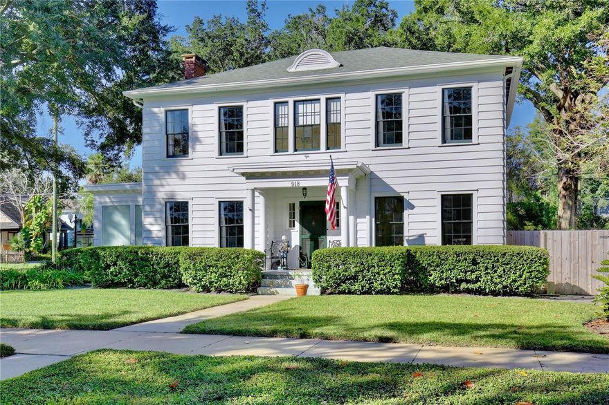 Welcome to 918 S. Palmetto Avenue! This 1921 Colonial Revival home is located on a large corner lot in Historic Downtown Sanford’s Residential Historic District. Featuring 3 bedrooms, 2 1/2 bathrooms + 2 flex rooms, this home also has a 600+ sq. ft., 2-car detached garage (new garage door doors with openers, 2025). This home has been thoughtfully renovated over the last decade, and the end result is a beautiful home that is also COMFORTABLE and FUNCTIONAL for modern day living. As you enter the home's foyer you'll notice the stately staircase, the centerpiece of the traditional Center Hall Colonial floor plan. The dining room and kitchen have been updated to an open floor plan, with a Carrera marble peninsula-style countertop, traditional white cabinetry, stainless steel appliances (natural gas range) and subway tile back splash. This kitchen features 3 pantries, one of which is currently used as a party closet! Around the corner is a nook/bar area, followed by the mud porch, and downstairs powder bath. The large living room features 4 large windows, a decorative brick fireplace, a custom built-in bookcase (2017), custom draperies, and 2 French doors leading to a sunroom/flex room/office. Hardwired ceiling speakers are located throughout the downstairs of the home - so great for entertaining! Beyond the living room is a downstairs sunroom/flex room/office, filled with windows that make it a light and bright space - perfect for an office or den. Upstairs, surrounding a large and open upstairs landing, you'll find the large primary suite, two additional bedrooms, large full bathroom with double sink vanity sink, and upstairs laundry room. A small yet magical room is found at the top of the stairs - a flex room, perfect for a small office, nursery, meditation/yoga retreat, reading nook...the big primary suite features three large double-hung windows, as well as a wall of custom closets installed by Closet by Design (2024). Walking into the classic en suite bathroom is like stepping into a relaxing spa, featuring Carrera marble tile, an antique cast iron claw foot tub, windows, amazing natural light, double sink vanity, and plenty of spaces to store everything neatly. The nearly .25 acre corner lot also features a private wood-fenced (2024) backyard, with a masonry garden wall, original brick paver patio, TREX deck, and a 600 SQ FOOT DETACHED GARAGE. This home is move-in ready: HVAC 2016 and 2021, ROOF 2021, full electrical re-wire 2016, re-plumbed (PEX and CPVC), natural gas tankless water heater, and new natural gas line (2016.) The irrigation system provides reclaimed water. Nearly all of the original double-hung wood windows have been professionally restored. This home was selected as the filming location for two DISNEY commercials and just last month, a feature film, reflecting its timeless appeal and photogenic design. She has been LOVED and is ready for her lucky new stewards! Don't miss your chance to own a piece of Sanford's past and future in this special home, neighborhood and community.