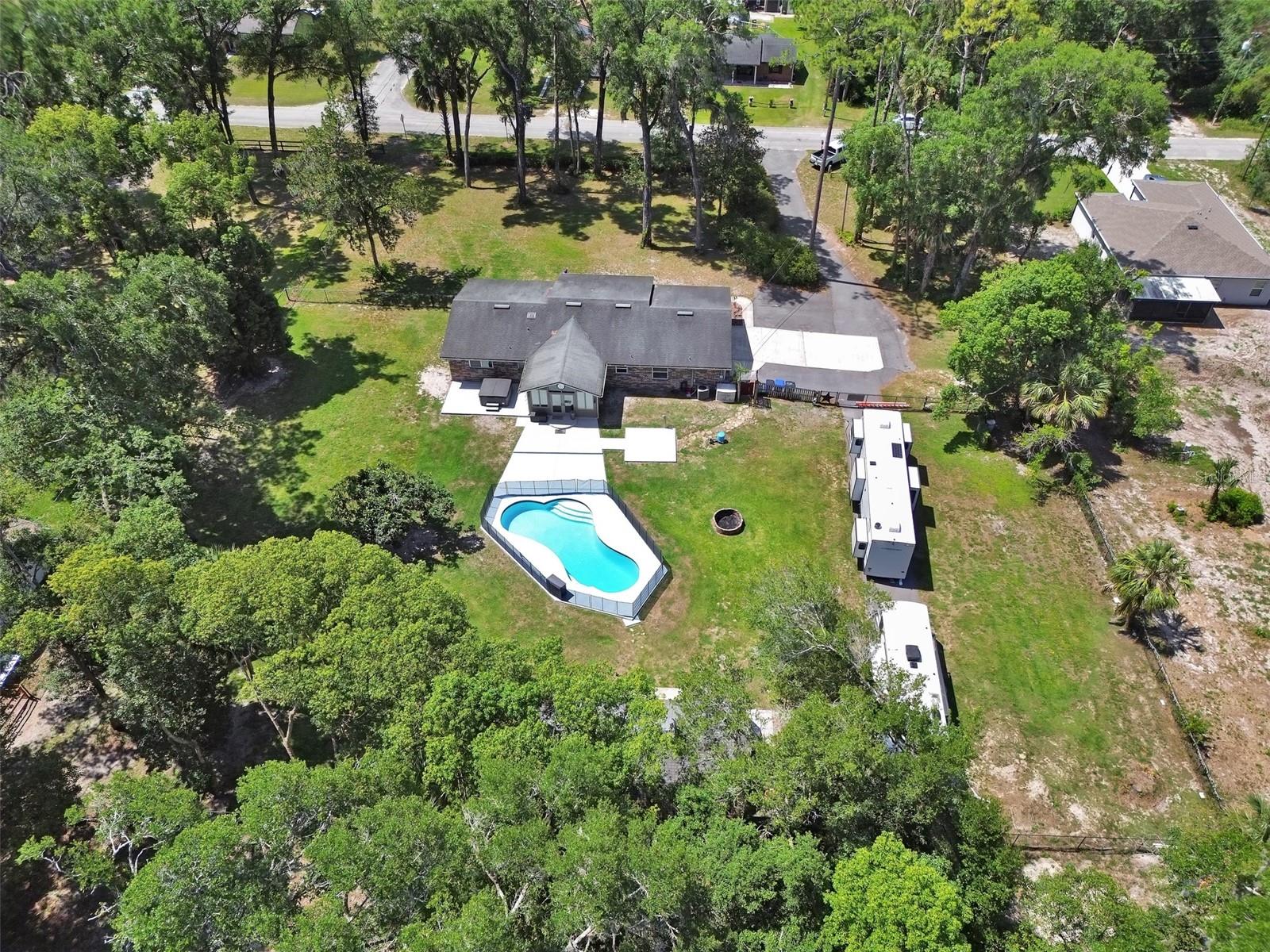 Now available! Looking for acreage? This DRY lot is in a prime Orange City location on 1.4 acres with a crystal swimming pool. Bring your RV's ( 2 power and water) hookups, fully fenced back yard, detached workshop/barn fully electric and no HOA! This 3-bedroom 2 bath pool home has had major remodeling completed. This home has a newly renovated kitchen, bathrooms and swimming pool. Interior features include huge kitchen with granite counters, soft close cabinets and upgraded appliances and new windows throughout. With a spacious and open floorplan this home is perfect for entertaining. Additional features include fully remodeled dual bathrooms with tub and shower and upgraded Polyaspartic floor coating throughout the living areas. Bonus room has lots of light with a cathedral ceiling facing the gorgeous fully re-done swimming pool. Exterior features are too numerous to list but include optic lighting, above ground spa, detached work room perfect for fitness or office space and beautiful mature landscaping for privacy. *Tons of parking and storage. Close to Blue Springs and country quiet, there is also easy access to 1-4, Deland and city conveniences. Do not wait as this home will be gone! Survey available. Call today for your appointment!
*Buyer to Verify all information. including square footage, room sizes, descriptions and zoning.