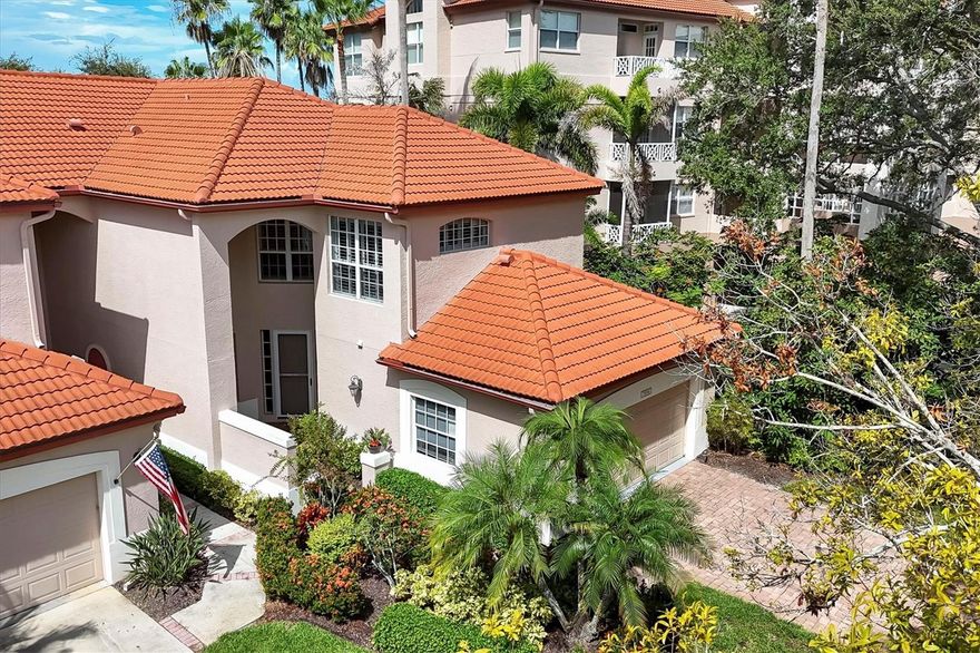STUNNING PRESTANCIA VILLA!! MOVE-IN READY bright and airy villa nestled within the gates of Prestancia Golf & Social Club in the charming Mara Villa neighborhood! Sun-filled, European-style high-end furnishings, completely TURNKEY two-story villa overlooking the first hole of the Stadium Course with BREATHTAKING SUNSETS! This 2,106-square-foot home offers 2 bedrooms, 2.5 luxurious baths fully renovated in 2019, a new barrel tile roof in 2021, and a versatile open loft/office designed to maximize natural light and comfort. The contemporary layout includes cathedral ceilings, neutral tile, hardwood floors, and expansive windows that bring the outdoors in. The eat-in kitchen with UPDATED APPLIANCES flows seamlessly into the dining area and out to a spacious two-story lanai with a tranquil stone water feature. This outdoor space is perfect for relaxing or entertaining. Upstairs, the private primary suite boasts a Juliet balcony with sweeping golf course views, a European-style en suite bath with soaking tub and rain shower, and dual closets. The second bedroom offers privacy and comfort for guests, with custom California Closets and premium finishes. The open loft includes a sleeper sofa and ample office space, which can easily be converted into a third bedroom. Professionally styled with European designer furnishings, this villa comes equipped with every necessity needed to start enjoying paradise NOW!! Just steps away, enjoy the glistening community pool and hot tub surrounded by lush landscaping. Prestancia provides 24/7 gated security and is recognized as an Audubon Cooperative Sanctuary, with 565 acres of mature trees, wildlife, and walking paths. Located only 5 MILES from world-renowned SIESTA KEY BEACH!! This home blends golf course tranquility with coastal convenience. TPC Prestancia Sarasota's Club, Social, Sports and Golf memberships are available and optional.