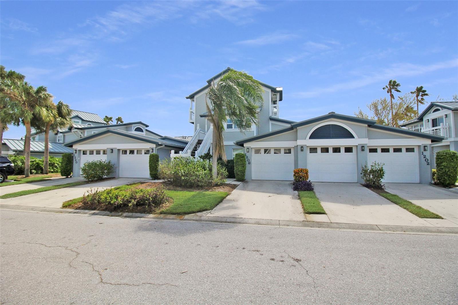 Experience coastal living at its finest in this 3-bedroom, 2-bathroom second-floor lakefront condo located in the desirable Gulf and Bay Club Bayside community in Siesta Key. With breathtaking views of the lake, pool, and tennis court from the screened-in lanai, this home is a perfect retreat. The kitchen is equipped with stainless-steel appliances, and the adjacent dining table offers a great space for enjoying meals with family or friends. The light and bright living room enhances the relaxed, coastal vibe.
On the first floor, the primary bedroom boasts a king-size bed and an attached bathroom featuring a walk-in shower with stunning marble from floor to ceiling. Upstairs, the second bedroom offers a spacious retreat with a queen-size bed, ideal for unwinding after a day of adventure. The second bathroom includes a dual vanity and a walk-in shower, while the third bedroom has two twin-size beds, perfect for guests or family members. For beach days, you’ll find all the essentials stored in the garage, making this condo a true beach lover’s paradise!
Upon arrival at Gulf & Bay Club Bayside, you'll be captivated by the beauty, serenity, and charm of this "Key West" style village. Stroll along the community path to the fishing dock, where you can take in the breathtaking views of the Intracoastal Waterway. Here, you might catch a fish, spot jumping dolphins, or even see a manatee.
Our spacious units, individually owned and decorated, are surrounded by lush, tropical landscaping, shell paths, and tranquil lakes with soothing fountains. Gulf and Bay Club Bayside offers a variety of on-site activities, including two heated pools, two tennis courts that can be converted to pickle-ball courts, and an exercise room. BBQ grills are also available for all guests to use, making it easy to enjoy a meal outdoors.
House Rules: No Motorcycles, golf carts, RVs, boats, or trailers allowed. No smoking. No burning candles inside of lodging. No parties. No Pets.