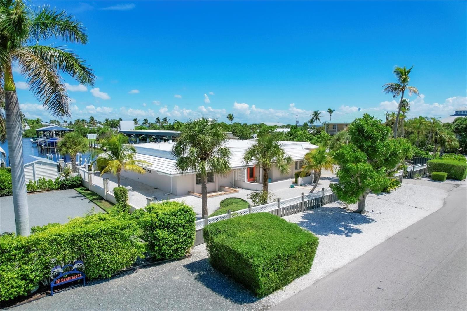 Weekly rate shown, please see description for detailed pricing.
Welcome to 161 Damficare, an exceptional residence in the heart of Boca Grande’s Historic District. With 3,276 square feet of thoughtfully designed living space, this home combines the character of historic island architecture with the comforts of modern luxury. Three spacious bedrooms and four full bathrooms accommodate up to six adults with ease, offering both privacy and comfort for extended stays.
The primary suite features a king bed and a beautifully finished bath, the second bedroom includes a queen bed, and the third offers two twin beds—perfect for family or guests. Elegant living and dining spaces are filled with natural light, complemented by a fully equipped kitchen appointed with premium appliances, including an ice maker. From casual mornings to formal gatherings, the home offers the perfect setting for every occasion. A private living room provides a quiet retreat, while central heating and cooling ensure comfort throughout the seasons.
Outdoors, the residence reveals a private heated pool framed by lush landscaping, creating an inviting setting for relaxation and entertaining. An expansive patio with a grill encourages al fresco dining, while a private boat slip, available by request, provides direct access to the surrounding waterways.
Every detail has been considered, from enhanced safety features and high-speed internet to multiple televisions and a dedicated workspace for those working remotely. Beach essentials, including chairs, umbrellas, and towels, are provided for convenience.
Situated within the Historic District, the home is just a short walk to Boca Grande’s pristine beaches, boutique shops, fine dining, and cultural attractions. Its waterfront setting offers inspiring views and endless opportunities for boating, fishing, and exploration.
161 Damficare offers a rare opportunity to enjoy the beauty of Boca Grande with the perfect balance of historic charm, modern amenities, and refined comfort.
Off-season: $5,600 weekly/$24,000 monthly
Mid-season: $6,125 weekly/$26,250 monthly
In-season: $7,000 weekly/$30,000 monthly