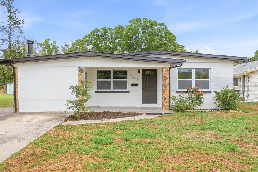 Welcome to this fully remodeled 4-bedroom, 2-bathroom home where modern design meets effortless Florida living. Situated on a quiet street with no HOA and located in a no flood zone, this high-and-dry property offers both peace of mind and exceptional style from the moment you arrive. The stone accented exterior, fresh interior and exterior paint, new gutters, and updated windows create stunning curb appeal and set the tone for what awaits inside. Step through the front door into a bright, open-concept floor plan filled with natural light and thoughtfully designed for both everyday living and entertaining. New luxury vinyl plank flooring flows seamlessly throughout the home, complemented by recessed lighting and ceiling fans with remotes in every room. The spacious living and dining areas are anchored by a striking stone accent wall and a modern chandelier, adding warmth and designer touches throughout. The fully updated kitchen is a true showpiece, featuring quartz countertops, white shaker soft-close cabinetry, a subway-style backsplash, and plenty of storage. A center island with waterfall edges serves as the focal point, paired perfectly with brand-new stainless steel appliances to create a space that is both functional and visually stunning. Designed with privacy in mind, the split floor plan places three guest bedrooms and a beautifully updated guest bathroom on one side of the home, while the primary suite is tucked away on the opposite side for a peaceful retreat. The primary suite offers a large walk-in closet and a luxurious en-suite bathroom complete with dual double-sink vanities, a custom barn-style vanity with modern fixtures, a huge LED-lit mirror, and a walk-in shower with glass panels and floor-to-ceiling tile. As you transition from the kitchen, you’ll find a convenient indoor laundry area and a private additional family room, creating flexible living space ideal for relaxing or entertaining. Step outside to your own backyard oasis featuring a sparkling pool, an expansive screened-in patio, and a fully fenced yard with white vinyl fencing perfect for enjoying Florida’s year round sunshine. This home has been completely upgraded with major systems already taken care of, including a new HVAC system, brand new water heater, new electric panel, and a 2020 roof. Ideally located just 10 minutes from Downtown St. Petersburg, enjoy waterfront dining, vibrant nightlife, and the scenic St. Pete Pier. Spend your days at St. Pete Beach just 15–20 minutes away or explore nearby parks and outdoor spaces. With convenient access to I-275 and only 25–30 minutes to Tampa International Airport, this location offers the perfect blend of lifestyle, convenience, and coastal living. This move-in-ready home truly checks every box, modern upgrades, functional design, and an unbeatable location.