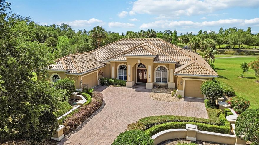 Perfectly placed at the end of a quiet cul de sac inside Waterlefe Golf & River Club, this home delivers something genuinely hard to find in a golf course community: privacy that does not feel compromised.

Positioned on a rare, baseball diamond shaped lot, the home opens wide across the golf course with no neighboring homes visible from the back. From the lanai, pool, and main living areas, the view is uninterrupted, calm, and expansive. You get the beauty of the course without feeling like your backyard is part of everyone else’s afternoon. It is the kind of setting that immediately stands out, and one that rarely comes available.

Waterlefe is one of Bradenton’s most distinctive gated communities, known for blending golf, riverfront scenery, boating, kayaking, dining, fitness, and social connection into everyday life. Set along the Manatee River, it offers a lifestyle that feels active without being busy and refined without being overdone. Whether it is time on the course, evenings at the club, a workout, or a quiet paddle on the river, the lifestyle is already built in.

Inside, the home reflects a style that has largely disappeared from newer construction. Arched openings, columns, lighted tray ceilings, a fireplace, and warm architectural detail create a sense of scale and character that feels established rather than trendy. It is elegant without being formal, and comfortable without feeling casual.

The layout is designed for how people actually live. A formal living room, true family room, and additional sitting area each serve a purpose, giving you space to gather, host, or simply step away without losing the flow of the home. The renovated kitchen blends bright finishes with classic architectural detail, creating a space that feels updated without losing character. A separate butler pantry and bar with wine fridge make entertaining feel easy and organized.

A dedicated office, formal dining room, and casual eat in area add flexibility for everyday life, hosting, and work when needed. The primary suite is positioned for privacy and comfort, with direct access to the outdoor living space.

Out back, the screened lanai becomes the center of daily life. The pool and spa are anchored by a rock waterfall feature that adds sound and movement without overwhelming the space. The outdoor kitchen makes it easy to enjoy dinner outside, host friends, or settle into a long Florida evening without constantly heading back indoors. With no rear neighbors in sight, the entire setting feels calm, open, and entirely your own.

Practical upgrades add another layer of confidence, including an almost new roof, whole house generator, and remote control hurricane shades. The home may also be sold furnished, making the transition even simpler for the next owner.

This is more than a home with a golf course view. It is a private, well designed Waterlefe residence where everything has already been thought through. No projects. No compromises. Just a home that lives the way it should.