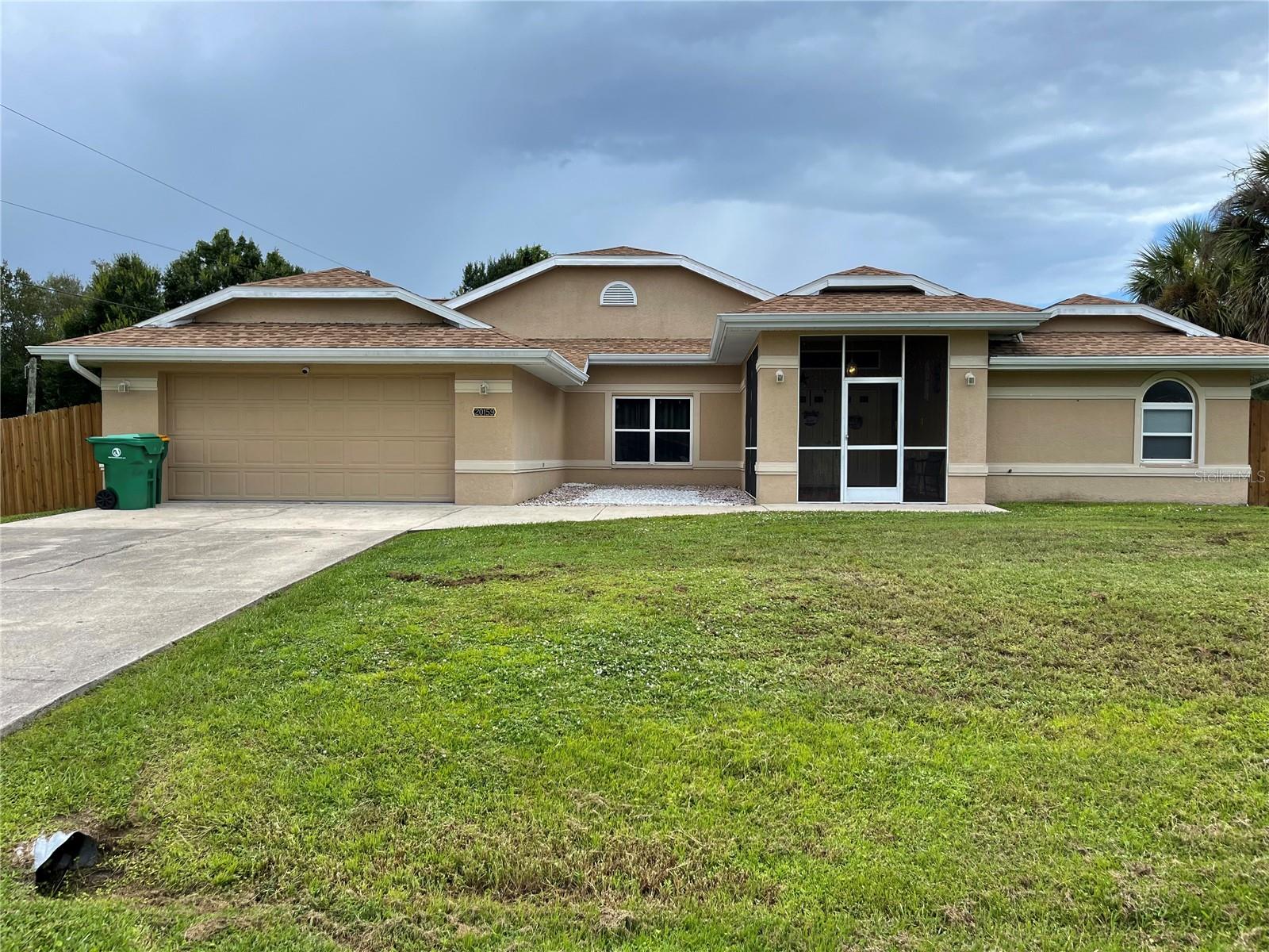Welcome to 20159 Gladstone Ave. This 1991 built home features 2,552 ft.² of living space under air; and 3,516 ft.² overall. Upon entry, you will immediately notice the large enclosed/covered front entry way leading to the double front doors. Entering the foyer, you will notice the spacious open airy layout with split floor plan. High cathedral ceilings, built in features, two separate living quarters, formal dining area, and plenty of storage space. The primary suite has two walk in closets, sliding door access to the pool, large primary bathroom with two separate vanity’s, soaking tub, and a large walk in shower. The kitchen overlooks the pool and has all the cabinet space you’ll ever need! Breakfast nook, eat in bar space, built in office section, with a new stove and dishwasher. Two guest bedrooms with plenty of hallway space in between. Large laundry room with sink and extra closet space. The pool deck has a covered entertainment area, pool half bathroom, storage closet, enclosed by the pool cage with a safety gate for additional safety. Fully fenced in yard on a half an acre of LAND, corner lot, with separate dog run! Water purification system connected to the property. Conveniently located near all the must have amenities. No HOA no deed restrictions and NO FLOOD ZONE. 2022 roof. Survey on hand saving you extra $. Scheduled your private tour today!