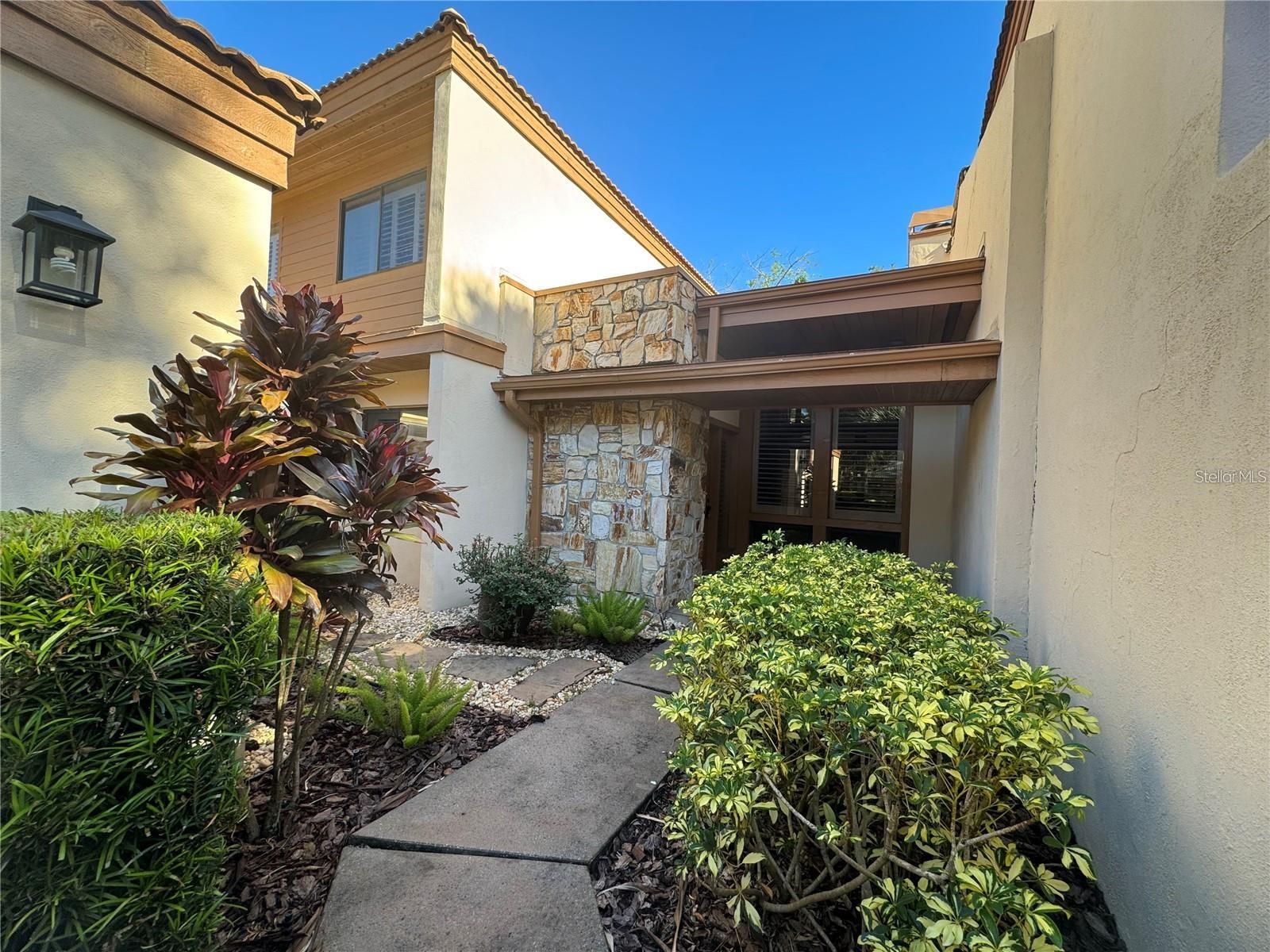 One or more photo(s) has been virtually staged. Luxurious Living in the Sought-After Gated Community of The Springs. From the moment you walk through the door, this completely renovated home exudes luxury and sophistication, this stunning residence has been meticulously upgraded with no expense spared. The spacious primary suite is conveniently located on the ground floor and serves as a private retreat, featuring sliding glass doors that open to a tranquil screened lanai. The spa-like en-suite bath includes a soaking tub, custom shower, two beautiful copper sinks, and vanity. There are dual walk-in closets. A separate split-zone AC system ensures comfort year-round. The heart of the home is the chef’s dream kitchen, outfitted with Bosch appliances, an induction cooktop, a Thermador refrigerator, a wine and bar fridge, granite countertops, an oversized island, and an abundance of custom cabinetry. The open floor plan connects the kitchen seamlessly with the dining area and a stylish living room, complete with a stunning stone fireplace—perfect for both entertaining and everyday living. Upstairs, you’ll find two spacious bedrooms with dark wood flooring, generous closet space, and a beautifully updated bathroom with a granite double vanity, custom shower, and additional storage. Plantation shutters throughout add timeless elegance, while the home’s layout maximizes natural light and flow. Outside, the screened lanai opens to a peaceful zen garden, offering the perfect space to relax and unwind. A two-car garage includes a built-in workbench, and the home comes complete with washer and dryer. As a resident of The Springs, you’ll enjoy a lifestyle unlike any other, with private horse stables, tennis and pickleball courts, basketball court, two pools, a clubhouse, and a sandy beach leading to the community’s breathtaking natural freshwater springs. Enjoy miles of walking and hiking trails, BBQ stations, a large playground, and a tight-knit, secure neighborhood with a true sense of community. This home is more than just beautiful—it’s the perfect blend of luxury, comfort, and lifestyle. Come experience it for yourself. You’ll fall in love the moment you arrive. Must have strong credit! Move in ready August 1st.