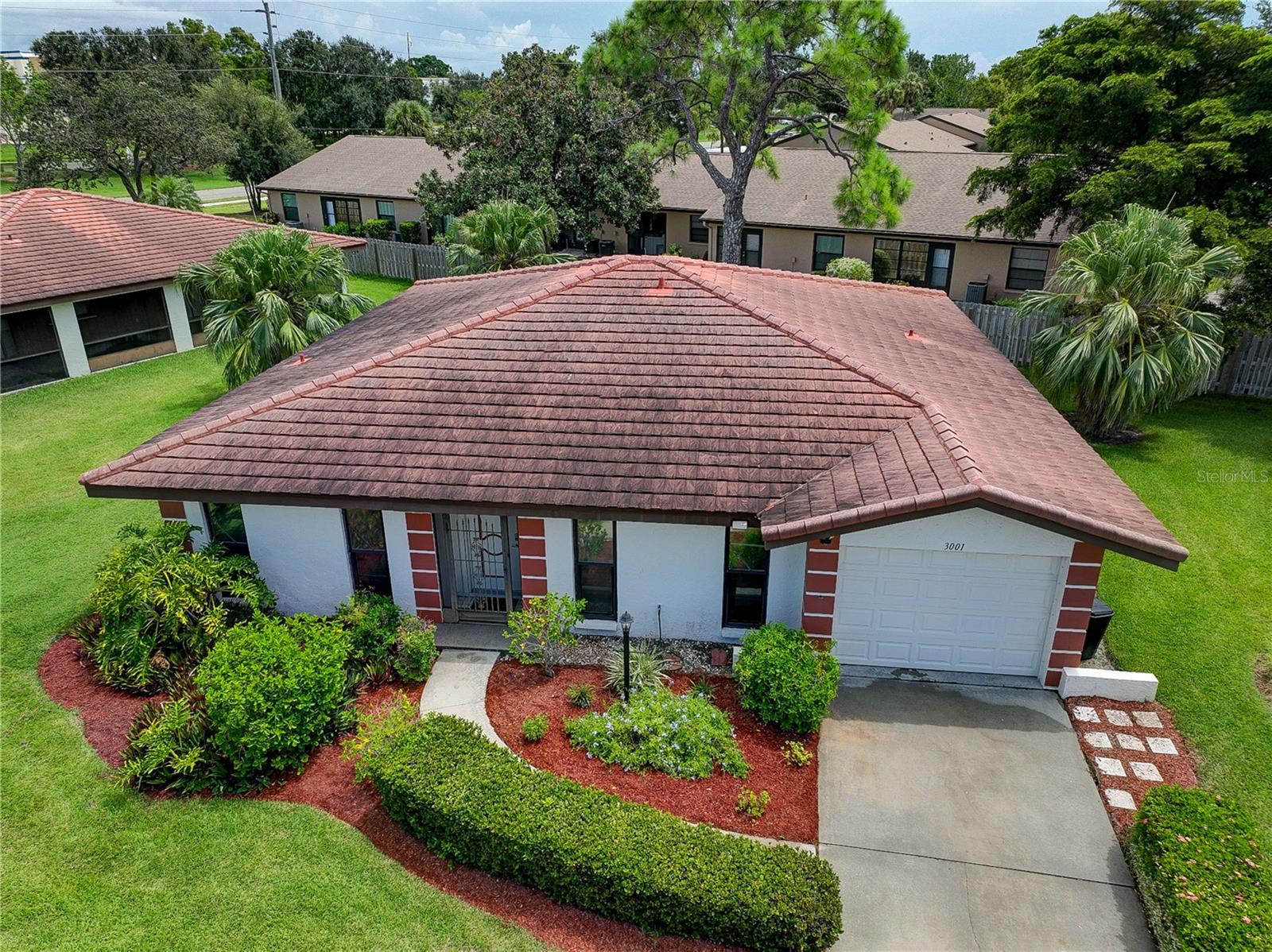 Situated in a distinguished condominium community, this refined residence at 3001 Vivienda Blvd, Bradenton, FL, combines the privacy of a standalone home with the benefits of condominium living. The property features a private garage and is part of a select enclave of detached homes within the complex, offering an ideal balance of seclusion and community engagement. With no age restrictions, this home welcomes residents of all generations, and pets are permitted within specified size guidelines. The master suite and guest bedroom are appointed with expansive walk-in closets, ensuring abundant storage. The master bathroom has been meticulously renovated to deliver contemporary elegance and functionality. The gourmet kitchen is equipped with premium stainless steel appliances, extensive cabinetry, and dual pantries, catering to culinary enthusiasts. An adjacent versatile space serves as an ideal office, breakfast nook, or additional dining area. Residents have access to a heated community pool, conveniently located steps away, fostering relaxation and social opportunities. Perfect for first-time buyers or seasonal residents, this home is strategically positioned near Bradenton’s pristine beaches, reputable schools, shopping, and cultural attractions, offering a lifestyle of sophistication and convenience.