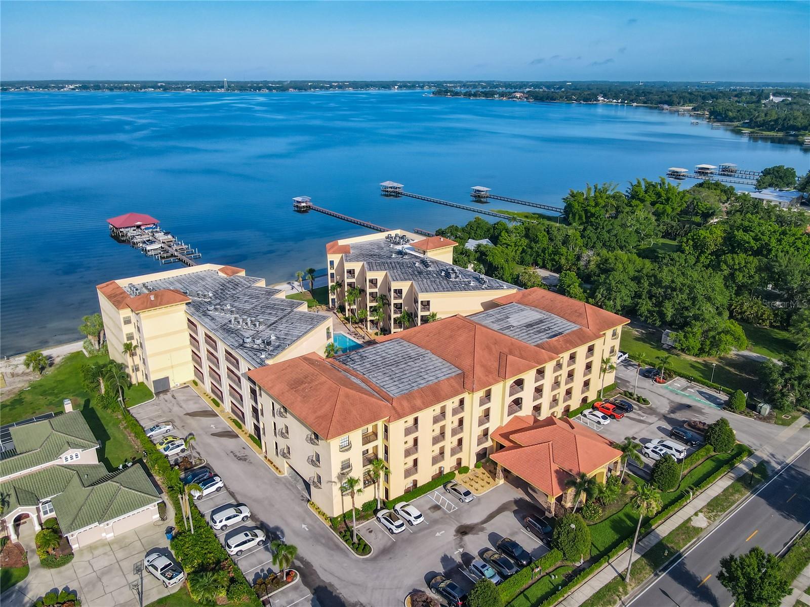 Welcome home to an Amazing Lakefront, Turn-key Executive Condo at Majestic Cove in Sebring, the Historic City on the Circle that is Enjoying a Renaissance in Central Florida. Majestic Cove is a Resort Style, 4 Story, 69 Unit Condo Complex on Beautiful Lake Jackson. Unit 409 is located on the 4th Floor of the Complex, easily reached from the Modern Lobby by Elevator, with Stunning Lakefront Views throughout the entire unit. Sebring is one of Highland County’s Top Recreation Areas with spectacular sunsets, fishing, boating, and swimming in beautiful blue Lake Jackson. This unit not only provides a grand lakefront view but a view of the resort style temp controlled pool and spa complete with a waterfall. Enjoy docking your boat in the boat slip that comes with the sale of this unit. Imagine, enjoying a day on the water and returning home to an evening in your luxury unit. Unit 409 is 1,546 sq feet with 3 bedrooms and 2 bathrooms, a living room, dining room, kitchen and laundry room. This unit has been upgraded and furnished from top to bottom. Create amazing dinners in the Chef’s kitchen with Stainless Steel Appliances and Granite Counters, or relax and enjoy two Spa Like bathrooms complete with Glass Surround Walk-In showers, hardwood flooring in the bedrooms and travertine flooring throughout all public spaces including the private balcony. The balcony can be accessed from the living room and the primary suite. The floorplan is welcoming, modern and open. Lots of storage with upgraded closets and finishes. If you are Looking to live in a beautiful town with lots of amenities, this is the home for you. Majestic Cove has an fitness center, exterior maintenance, security, a beach and a Resort Recreation Area with a Temp Controlled Pool, Spa and lounges with tables and chairs. Walk or ride your bike to the Community Theatre, Restaurants, and downtown entertainment. Located near shopping, South Florida State College, the Wildstein Center for Performing Arts, Advent Health Hospital, and HCA Florida Highlands Hospital, plus many large employers. Working or retired, Sebring is the perfect spot and this condo offers a rare opportunity to own an affordable home in a Beautiful location.