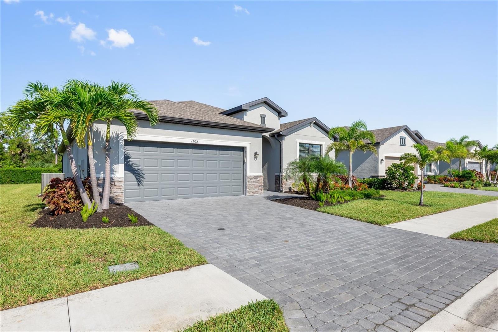 Welcome Home to this split 3 bedroom,(+office/flex room) featureing 3 full baths and a 2 car garage with over 2200sq/ft of interior living space. in biscayne Landing - offering LOW HOA FEES, NO CDD, and in FLOOD ZONE X (flood ins. NOT required) This home offers perfect space for your Florida living and entertaining comfort. This Marsala floor plan is complemented by brand new custom granite counters in the kitchen and bathrooms complemented with diagonal 18in ceramic floor tile, accented by crown moulding in the common areas. The spacious primary bedroom boasts 2 walk-in large closets as well as a spacious ensuite bathroom with dual sink vanity, garden soaking tub and HUGE glass enclosed step in shower. Each additional bedroom boasts its own private bathroom, 1 with a tub/shower combo and the other en-suite with a step-in shower. Both have matching granite counters. The open concept kitchen features a large center island with breakfast bar seating space, walk-in pantry and large side buffet with plenty of additional cabinet storage for all of your kitchen gadgets. The large lanai opens to a community maintained back yard with plenty of room to creat your own private backyard oasis. Improvements since new include: Brand new granite counters with new sinks, crown moldings in common areas, stylish ceiling fans, bedroom curtains, Bali cellular triple slider shade, full perimeter gutters with downspouts and neutral paint throughout main living areas. Biscayne Landing is a new gated development conveniently situated in the middle of Charlotte County on El Jobean Road(HWY 776) providing easy access to Charlotte Sports Park and Charlotte County Fair Grounds while beaches, dining and shopping are all just minutes away. Come take a look at all this home and all the community has to offer. Amenities include a resort-style pool, cabana area, pickleball courts, a fitness center, and a community clubhouse, all exclusive to residents. Internet and cable services are provided by Hotwire Communications and are included with home ownership.