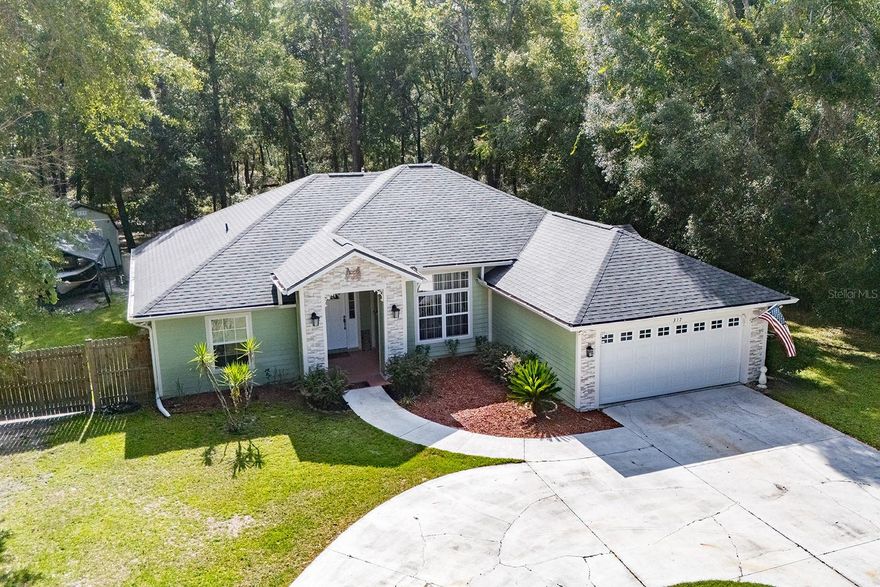 Beautifully maintained 3-bedroom, 2-bathroom home located in the desirable Fort White Station subdivision. Built in 2005, this residence features an open floor plan, ideal for both everyday living and entertaining. Recent upgrades include a new roof and new central heating and air system, providing comfort and peace of mind. Situated on a quiet cul-de-sac, the property offers a fenced backyard with a pool and hot tub, creating the perfect outdoor retreat. The kitchen is appointed with granite countertops and custom cabinetry. The primary suite includes a spacious ensuite bathroom with double vanities. This home combines style, functionality, and location—ready for its next owner.