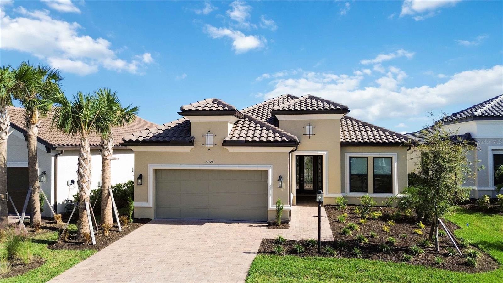 Why wait to build when you can move right into this designer-upgraded masterpiece in Esplanade at Skye Ranch? Perfectly positioned at the end of a quiet, private street, this barely lived-in Lazio floor plan offers the ideal blend of luxury, function, and Florida lifestyle. With 3 bedrooms + a den, 3 full baths, and a spacious 3-car tandem garage, this home was built to impress and designed for everyday comfort.
From the moment you walk in, you’ll notice the difference—over $200,000 in premium builder upgrades paired with thoughtful post-build enhancements that take this home to the next level. Brand new crown molding throughout adds classic elegance and polish, elevating every space. Soaring ceilings and sleek porcelain tile floors enhance the open, airy feel, while natural light pours in from every angle.
The chef’s kitchen is an entertainer’s dream—quartz countertops, soft-close wood cabinetry, upgraded appliances, and an oversized island that invites gatherings both big and small.
Your owner’s suite is a true sanctuary, complete with a large bay window, a luxurious bath with dual vanities and an expansive walk-in shower, and a closet so spacious it could double as a dressing room. New impact windows are being added in the master bedroom bay windows for enhanced safety, comfort, and efficiency.
Step outside to the lanai, where you’ll find $20,000 in electric hurricane shades (being installed late summer of 2025)—effortless protection and privacy with the touch of a button, so you can enjoy the outdoors no matter the weather.
But the lifestyle doesn’t stop at your doorstep. Living in Skye Ranch means access to resort-style amenities that rival luxury vacation destinations: multiple pools, tennis and pickleball courts, a state-of-the-art fitness center, indoor basketball, scenic walking and biking trails, and the brand new social and recreational hubs—The Hub, The Venue, Rendezvous Park, and Turner Park. Skye Ranch School will also be opening this fall!
This home is better than new—meticulously upgraded, move-in ready, and situated in one of Southwest Florida’s fastest-growing, most desirable lifestyle communities. If you’re looking for elegance, comfort, and zero compromises… this is the one.