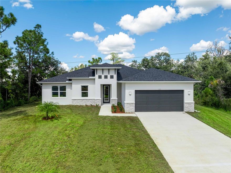 MOVE IN READY! This brand new construction home on a OVERSIZED LOT features 3 Bedrooms + Flex/Office, 2 Baths, 2 Car Garage. NO HOA, NO CDD AND NOT IN A FLOOD ZONE. The open-concept floor plan seamlessly connects the kitchen, dining, and living areas—perfect for everyday living and entertaining. The kitchen features quartz countertops, stainless steel appliances, soft-close cabinetry, and a large center island. The spacious primary suite offers a walk-in closet and spa-style bathroom with dual vanity, tiled walk-in shower, and sleek fixtures. Additional bedrooms are generously sized, ideal for family or guests. This home includes 9'4" ceilings and tile plank floors throughout home. Our homes are energy efficient with spray foam insulation and we include an energy efficient hybrid water heater. North Port is one of Florida's fastest-growing cities, offering the perfect combination of affordability, convenience, and quality of life. With a strong sense of community and a wide range of amenities, it’s a great place to live, work, and play. The city is also home to the North Port Aquatic Center, Atwater Community Park, and many other recreational spots for residents and visitors alike.  The pictures shown are representative of this floor plan, but of a different home. One or more photo(s) has been virtually staged.