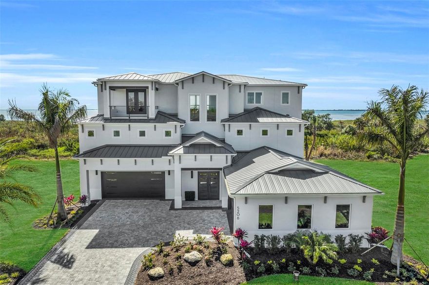 PRICE REDUCED $500k!! The latest crown jewel of Sarasota Bay, the DOMINICA II!  

The view from the balconies. Comfortable spaces to entertain. Ample room for cars, recreational water toys, and whatever else you love. There’s no more extraordinary place to call home than the Dominica II, a stunning three-story floor plan that provides breathtaking design features without sacrificing the warmth of home. Complete with four bedrooms, four-and-a-half bathrooms, and 4,883 square feet of beautiful space, this one-of-a-kind, custom designed home makes everyday life anything but ordinary.

With a sophisticated, high-end design, the Dominica II provides the perfect mix of luxury, function, and comfort. The moment you enter, you’ll immediately feel at home — whether you want to cook a feast in the contemporary kitchen or enjoy a peace and quiet on the lanai overlooking the pool and spa, this home gives you the bright, open space you need to do it all.

With superior features and finishes, from the open-concept living space to the third-floor bonus room, the elevator to the drive through garage that can hold 8-10 cars, this home has everything you ever imagined. The Dominica II also includes a private den, an airy great room/dining room, and an outdoor kitchen on the second-floor balcony. 

When you’re ready to unwind, the second-floor owner’s suite is a peaceful oasis located just off the great room. Pamper yourself in the spa-like bathroom, with its enormous walk-in shower, beautiful soaking tub, dual vanities. You’ll love the enormous, large walk-in closet and having private access to the balcony! 

This unique residence has a third floor featuring three bedroom suites in addition to the bonus room, plus a balcony that runs the entire length of the back of the home with a stunning view of the Sarasota Bay. Enjoy your personal observation dock with gorgeous views of Sarasota Bay!