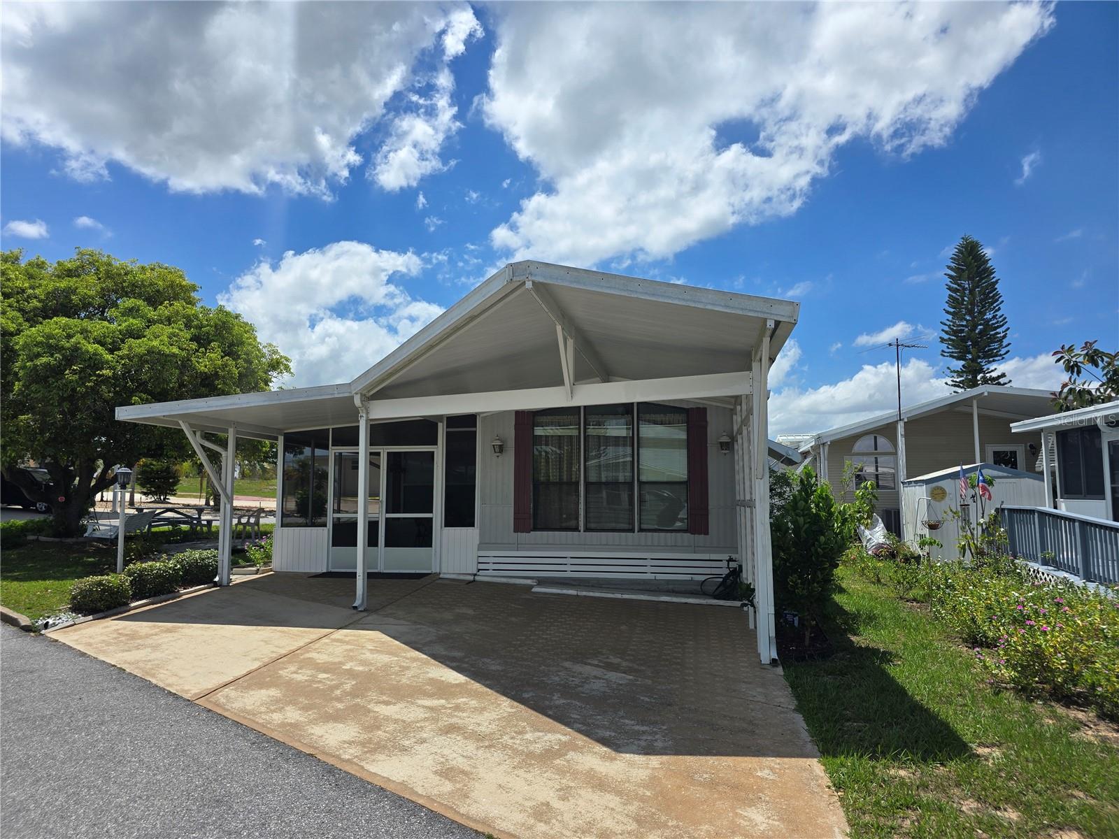 Welcome to West View Ridge, a 55+ gated mobile home community in Haines City, Florida! This charming 1 bedroom, 2 bath home with a bonus room sits on a desirable corner lot. Enjoy a screened-in lanai, covered carport, a metal roof, and a newer HVAC (less than 2 years old). The home comes fully furnished and move-in ready!
Community amenities include a heated pool, mini putt-putt golf, pickleball courts, bocce ball, and shuffleboard. Conveniently located near restaurants, shopping, medical facilities, I-4, US-27, and all the popular Florida attractions. Call today for a private tour.