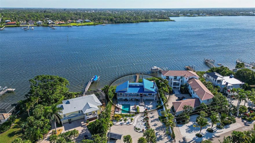 Embark on the ultimate coastal living experience with this extraordinary Manasota Key residence, a haven perfectly suited for singles, families, multi-generational living, or astute investors. Nestled along the Bayfront with exclusive deeded beach access, this unique property boasts four bedrooms and four and a half bathrooms. What distinguishes this home is its innovative design, featuring two distinct residences under one roof, each with private entrances. Whether utilized as a cohesive home or divided for in-laws, teenagers, the flexibility is unparalleled. Recently renovated in 2021, the interior showcases contemporary sophistication with upgraded cabinetry and appliances in both kitchens. The main-level kitchen boasts breathtaking granite countertops, while the lower-level kitchen showcases stunning quartz. Architectural details such as vaulted ceilings with beam accents, a captivating fireplace, and exquisite lighting contribute to the home's distinctive charm. Newer installed hurricane windows and sliders, except one equipped with a hurricane shutter, ensure durability and security. Step outside to your private dock, featuring a 10,000 lb. lift installed in 2022, water, and electric connections. The metal roof, replaced in 2020, enhances the home's resilience. Porcelain tile graces the main level, while the lower-level features beautiful tile. Bathrooms are adorned with beautifully tiled showers and upgraded fixtures. The master bedroom on the main floor is a true sanctuary with an en-suite featuring a walk-in shower and a jetted bathtub for two. Expansive living spaces on both floors offer breathtaking views from every window or slider. Outdoor living is elevated with decks running the length of the house, a spacious paver patio hosting a firepit, bocce ball court, and areas for kayaks and grilling. The resort-style pool with a sunbathing ledge and adjacent tiki bar creates an entertainer's haven. This meticulously maintained property includes a two-car garage, ample storage, and guest parking. Positioned on the Intracoastal with deeded Gulf of Mexico access, relish the best of both worlds—spectacular sunrises, sunsets, and a private entrance to the beach. Zoned as a two-family dwelling, this property presents endless opportunities. Witness dolphins play, observe manatees, and enjoy the convenience of two bridges to the island for mainland shopping. Your waterfront retreat awaits—call today for comprehensive details and to arrange your exclusive tour.