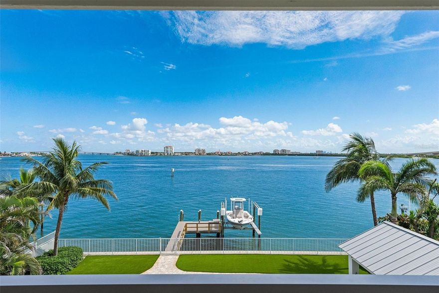 Simply stunning! Spend every single day relishing the sweeping, panoramic views of Boca Ciega Bay from this impeccably remodeled high-and-dry waterfront sanctuary on the exclusive island paradise of Tierra Verde. By day, sunlight dances across expansive waters; by night, the twinkling lights of the Don CeSar, St. Pete Beach, and Isla del Sol illuminate the horizon, creating an enchanting backdrop for island living at its finest.
The gracefully designed interior reflects coastal sophistication and casual elegance, with no element left untouched. This home is ready for you to move in and enjoy in the highest of style, no further work required.
The gourmet kitchen and primary bath feature luxurious Cambria quartz countertops paired with custom cabinetry, while the guest bath charms with classic marble accents. Original hardwood floors add timeless warmth and character, beautifully refinished to complement the home’s graceful aesthetic.
An absolute delight for both the chef and the entertainer, the kitchen boasts premier Wolf, Sub-Zero, and KitchenAid appliances, an RO water purification system, a wine cooler, and a giant, gorgeous island, flowing effortlessly into outdoor spaces ideal for relaxed gatherings or festive celebrations, making it easy to enjoy every day of your new, elevated waterfront lifestyle.
Adjacent to the main living area, the built-in bar is the perfect place to prepare your favorite libations, complete with quarts countertops, beverage refrigerator, and stylish wood shelving.
The master bath is a sumptuous and elegant, with a large slipper tub perched in front of a massive window overlooking the open water. Simply dreamy. The walk in shower with frameless glass surround, gorgeous dual-sink vanity, and tremendous walk-in closet complete the extravagance.
Outdoor living here is extraordinary. Beside the sparking Pebble-Tec pool, you’ll find a large, covered lounge area with an expansive outdoor kitchen, featuring a Wolf gas grill and a True beverage refrigerator, providing alfresco dining in front of breathtaking waterfront views. It’s impossible to overstate the excellence this super cool outdoor space, which will certainly become your outdoor living room.
Launch into Boca Ciega Bay and the Intracoastal directly from your backyard—complete with a substantial seawall and a Trex-clad dock featuring a convenient 10,000 lb boat lift. Positioned within a minimum wake zone, the home perfectly balances the incomparable beauty of open water living with manageable boating and access to an amazing array of exceptional boating water.
Impact-rated glass throughout and a brand new roof provide security in waterfront living, while a giant garage (with room for three cars and the requisite golf cart) and large bonus room provide space for all of the toys necessary to take advantage of supreme Tierra Verde living. 

Tierra Verde is renowned for its refined, yet relaxed island lifestyle, with its vibrant boating culture, acclaimed dining options, and quick access to the both the cultural heartbeat of nearby downtown St. Petersburg and the pristine white sands of Ft. DeSoto and St. Pete Beach. This remarkable property isn’t merely a home; it’s your personal invitation to savor life on one of Florida’s most desirable locales. 

All measurements are approximate, buyer to verify at their discretion. You must see inside of this property to appreciate it. You won't be disappointed.
