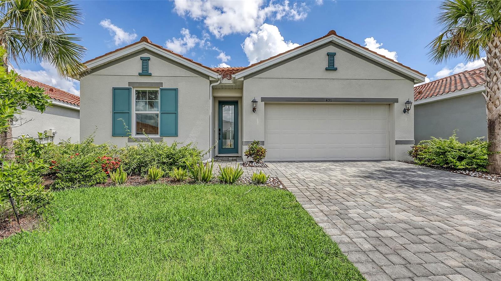 Welcome to this pristine 3-bedroom, 2-bathroom home in the beautiful gated community of Venice Woodlands. Built in 2023 and offering modern living in a prime location! This immaculate, move-in ready home features an open-concept layout with tile flooring throughout, high ceilings, abundant natural light, and appealing finishes that suit any style. This home features hurricane impact-resistant windows, ensuring peace of mind during stormy weather. The spacious kitchen boasts quartz countertops, stainless steel appliances, a large island, and ample cabinetry-perfect for both everyday living and entertaining. The primary suite offers a peaceful retreat with a walk-in closet and a luxurious en-suite bathroom featuring dual sinks and a walk-in shower. Enjoy Florida living at its finest with a covered lanai overlooking a beautifully landscaped yard, ideal for morning coffee or evening relaxation. Lawn mowing/irrigation is included in the HOA fee. Venice woodlands is a gated, resort style community with NO CDD fees, and low HOA fees, offering top-notch amenities including a sparkling community pool, clubhouse, fitness center, and pickleball courts. Located just minutes from Nokomis and Venice beaches, nearby shopping, dining and convenient access to I-75, this home combines the best of comfort, style and location. Whether you're looking for a full-time residence or seasonal getaway, this is Florida living done right. Schedule your private showing today!