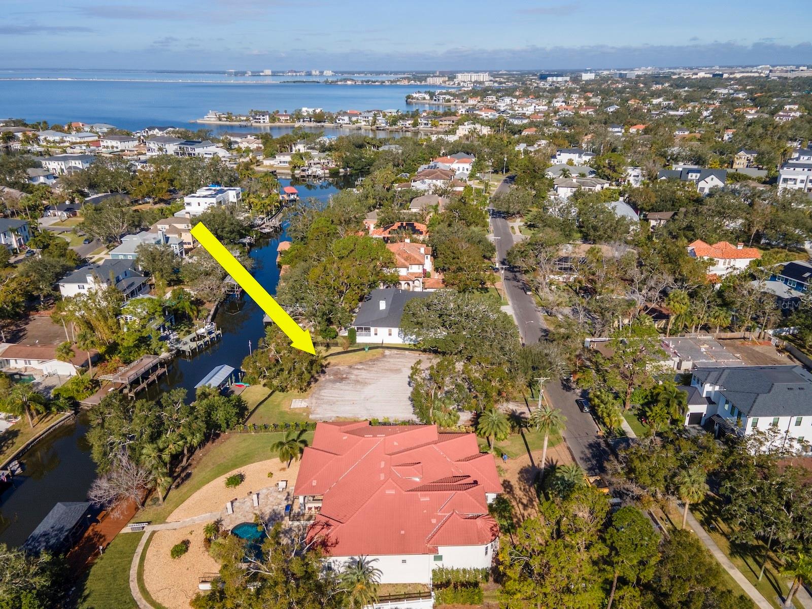 Oversize Waterfront Lot (20,115 sq ft./ almost half an acre) Vacant on Dundee River in Sunset Park. Great access to Tampa Bay. Above average navigability. New 27 ft. boat house. Ready for new construction on the canal leading to the bay. Survey recently completed in attachments.
