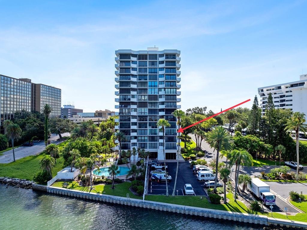 **MILLION-DOLLAR VIEWS AT PRELUDE 80 - TURNKEY WATERFRONT LIVING** Welcome to Prelude 80, an exclusive and highly desirable condominium community in the heart of Clearwater. This exceptional corner unit is being sold FULLY FURNISHED and features over $120,000 in recent upgrades! Among the enhancements are floor-to-ceiling hurricane-impact windows and doors, a fully renovated kitchen, updated flooring throughout, upgraded lighting and ceiling fans, a new NuvoH2O water softener system, modern faucets, and fresh interior paint. Inside, you're immediately welcomed by an open-concept living and dining area flooded with natural light. The expansive glass windows frame the sweeping views of Clearwater harbor and the intracoastal waters. As a corner unit, the home boasts a large wraparound balcony—an ideal setting for sipping your morning coffee or enjoying the dramatic daily sunsets. The updated kitchen is both functional and refined, featuring solid-surface countertops, stainless steel appliances, a breakfast bar, and sleek, contemporary cabinetry. The home features a desirable split-bedroom floor plan for added privacy. The bright and airy primary suite offers a walk-in closet and a spa-style bathroom designed for relaxation, while the second suite includes its own full bath and walk-in closet—perfect for guests or flexible use. The property includes one assigned covered parking spot (#45) with ample guest parking available on the waterside. An external storage unit (#43) provides added convenience, and shared laundry facilities are located just steps away on the same floor. Life at Prelude 80 means enjoying a true resort lifestyle. Residents have access to a heated waterfront pool with expansive water views, a well-equipped fitness center, a clubhouse with full kitchen, a media room with a library and pool table, BBQ grills, a shaded gazebo and a dedicated bike room. The building offers secured access with a private lobby, and Best of all, all special assessments have already been paid in full—allowing you to move in with confidence and ease. This premier location is just one block from the Pinellas Trail and within easy walking or biking distance to Clearwater Beach, local restaurants, grocery stores, and downtown attractions. You're also just minutes from Coachman Park and The Sound Amphitheater, a quick drive to the charming town of Dunedin, and only 40 minutes to Tampa International Airport. From daily dolphin sightings to peaceful evenings watching the sun dip below the horizon, this residence delivers a waterfront lifestyle that’s truly unmatched. Schedule your private showing today and experience the luxury and tranquility of life at Prelude 80.
