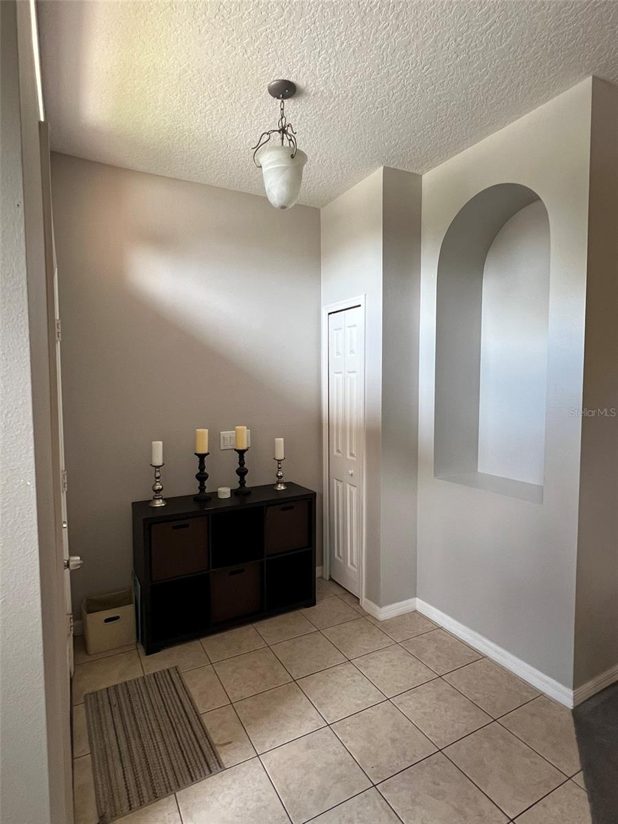 This 4 bedroom 2 bath home is partially furnished and move in ready, bring your laptop and textbook! Students are welcome. Please call JML Realty Investments for more info and to view interior. This home is spacious with two living areas, an eat in kitchen, dining room, with high vaulted ceilings throughout. Stainless steel appliances in kitchen with granite counter tops, large closet pantry and a kitchen island. Very large primary bedroom and bath. Primary bath has double sinks, separate shower and tub plus a commode closet. There are fans in every room. Washer dryer included in separate laundry room. There is a large 2 car garage. Lawn service is included in the rent. Owner is looking for long term rental minimum one year. Yard service included in rent payment.Subdivision has a community pool. Located within minutes to UCF.