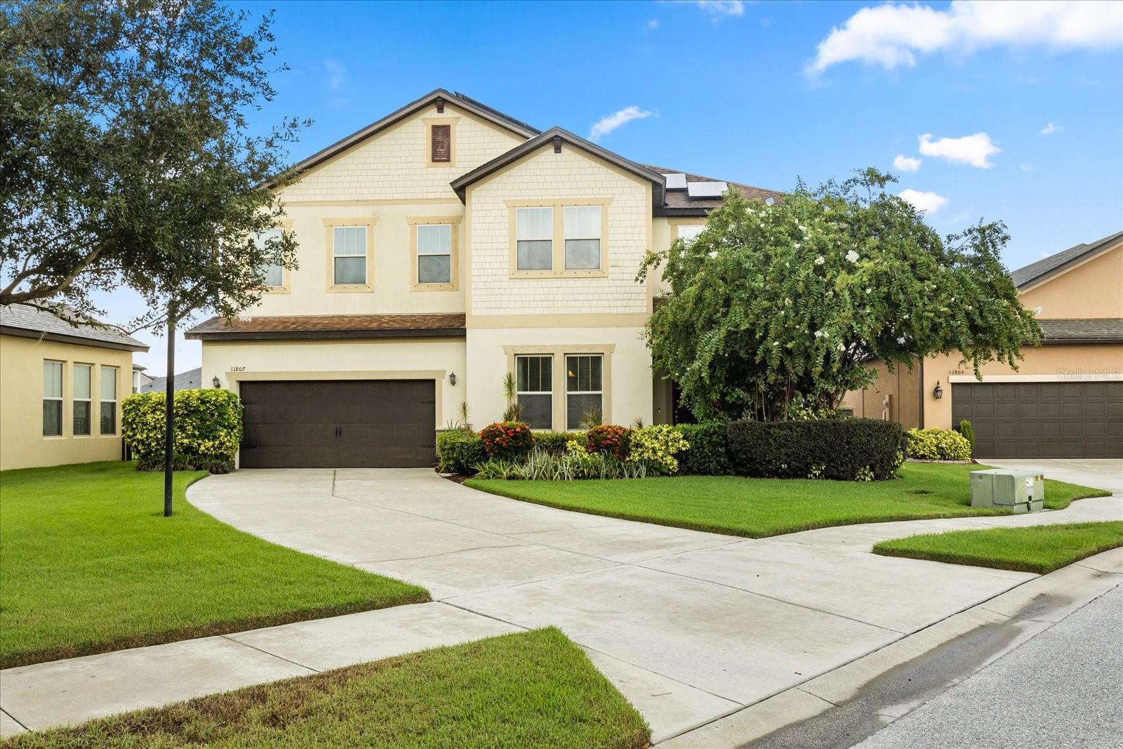 **This house comes with a REDUCED RATE through the seller's preferred lender. This is a lender-paid rate buydown that reduces the buyer's interest rate and monthly payment.** Welcome to a warm and elegant executive home nestled on a peaceful cul-de-sac in the highly sought-after gated community of WaterLeaf. With almost 3,300 square feet of beautifully designed living space on an oversized waterfront lot, this home is where comfort, elegance, and functionality come together in perfect harmony. Step into a private oasis that feels like a year-round retreat. A resort-style saltwater pool and spacious spa invite you to relax, recharge, or entertain on the expansive extended screened lanai, all while taking in tranquil pond views. Whether you're hosting friends or enjoying a quiet sunset with loved ones, this outdoor space is truly something special. A brand-new roof is already scheduled, and fully paid-off solar panels ensure long-term energy efficiency and significant savings—giving you peace of mind for years to come. Inside, the home welcomes you with warmth and sophistication. A formal dining room, currently styled as a home office, and a grand staircase set the tone for the rest of the space. The bright and open Leisure Room offers sweeping views of the pool and pond, blurring the line between indoors and out. The heart of the home—the gourmet kitchen—is a chef’s dream come true. Thoughtfully equipped with 42” upper cabinets with crown molding, granite countertops, stainless steel appliances (including double ovens and a 30” cooktop), a large center island with pendant lighting, and a walk-in pantry—plus a convenient Butler’s Pantry—this space is as functional as it is beautiful. Enjoy peaceful mornings in the Morning Room, sipping coffee as you watch the sun rise over the water. A guest/pool bath with direct lanai access adds a thoughtful touch. Upstairs, you’ll find a split-bedroom layout that gives everyone privacy and space. The primary suite is a relaxing haven with its own private balcony, walk-in closet, and en-suite bath. One guest bedroom includes a private bathroom, while two others share a Jack & Jill design—perfect for growing families or hosting guests. A generous loft with a dry bar offers endless possibilities for a media room, playroom, or home office, and the upstairs laundry room—with built-in cabinetry and counters—is conveniently located near the primary suite. As part of WaterLeaf, you’ll enjoy gated peace of mind along with community amenities like a resort-style pool, clubhouse, dog park, playground, and scenic walking trails. Perfectly positioned near Publix, WaWa, shopping, dining, St. Joseph’s Hospital South, I-75, Hwy 301, and Florida’s beautiful Gulf Coast beaches—this home offers the ideal blend of luxury, lifestyle, and location. Come experience what it feels like to truly love where you live. Schedule your private showing today—you won’t want to leave.