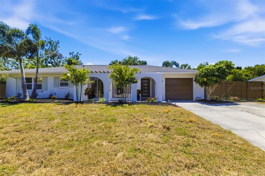 Don’t miss your chance to own this one-of-a-kind, fully renovated mid-century modern gem in Sarasota’s coveted Southgate community. Opportunities like this are rare, and this home is completely move-in ready. Perfectly positioned just minutes from Downtown Sarasota and Siesta Key, this residence delivers the ideal blend of designer style, modern comfort, and unbeatable location.

Step inside and experience a thoughtfully reimagined 4-bedroom, 3-bath home where every detail has been curated for both everyday living and effortless entertaining. Luxury vinyl plank flooring flows throughout, complemented by recessed lighting and a striking custom accent wall with integrated mood lighting. The sleek, wall-mounted electric fireplace creates a warm, contemporary focal point for gathering with family and friends.

The show-stopping kitchen is designed to impress, featuring quartz countertops with a dramatic waterfall edge, a full-height quartz backsplash, and custom cabinetry with soft-close functionality. A premium GE Café stainless steel appliance package, custom hood, upgraded 33-inch sink with waterfall feature and rinse system, built-in wine cooler, and discreet under-cabinet outlets complete this modern culinary space, perfect for hosting or enjoying quiet evenings at home.

Unwind in spa-inspired bathrooms, all fully renovated with custom cabinetry, large-format tile, and upgraded lighting. The primary suite offers a luxurious retreat with floor-to-ceiling tile and a walk-in rain shower, creating a true at-home sanctuary.

Beyond aesthetics, this home offers peace of mind with extensive upgrades, including a new 2026 roof, new AC system, new insulation, updated PVC plumbing, and impact windows throughout. Additional enhancements such as a new GE washer and dryer, fresh exterior paint, new sod and landscaping, new front entry door, backyard fencing, and full rain gutter system ensure both style and function.

Located in Southgate with optional HOA and access to a community pool, you’ll enjoy a lifestyle that combines convenience, charm, and coastal living at its finest. Imagine mornings near the beach, afternoons exploring downtown, and evenings relaxing in your beautifully designed home.

Your Sarasota dream home awaits. Schedule your private showing today before this exceptional property is gone.
