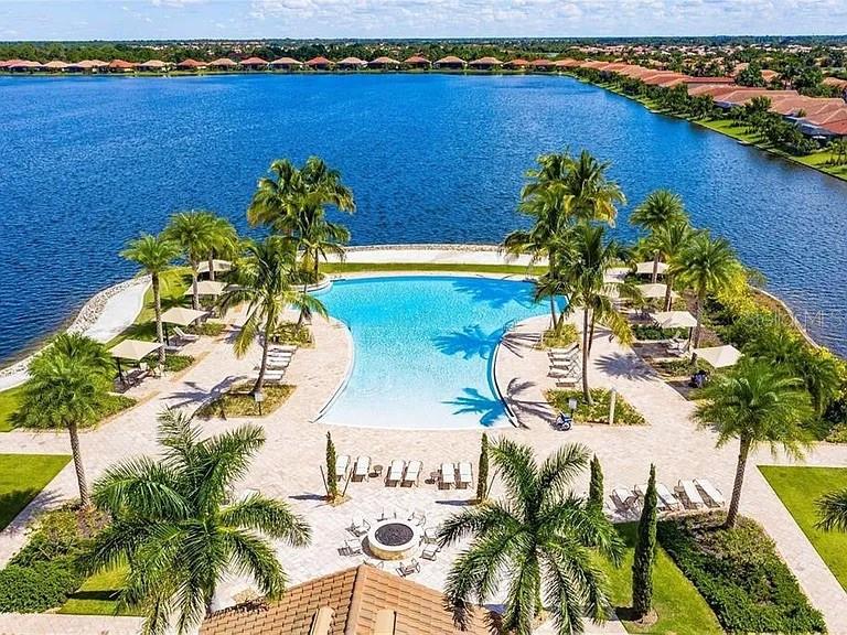 Amazing resort-style amenities are just one reason to love this light-filled home with breathtaking LAKE VIEW in Toscana Isles which offers an open, flowing layout, and quality finishes—available now for an annual rental. With FULLY FURNISHED 3-BEDROOM or 2-bedroom-plus-DEN home,the space is both functional and inviting. The main living area welcomes you with natural light and connects seamlessly to the dining area and kitchen. Quartz countertops, wood cabinetry, stainless steel appliances, and a center island designed for seating or meal prep make the kitchen as practical as it is stylish. The primary suite is tucked away at the rear of the home and features a walk-in closet and a private en-suite bath with dual sinks. The second bedroom is located near the front of the home, adjacent to the second full bathroom. A versatile den offers space for working from home, hobbies, or occasional guests. Enjoy peaceful outdoor living from your COVERED LANAI, accessed by sliding doors from the rear of the home, with a lake view.
Toscana Isles is a gated community offering an infinity-edge pool with lake views, tennis and pickle ball courts, a fully equipped fitness center with specialty workout rooms, a dog park, playground, and a clubhouse with regular events and social spaces. Residents also enjoy kayaking, canoeing, and fishing on over 60 acres of lakes. The community activity director keeps the calendar full of events and social opportunities.This home is the perfect retreat with access to beaches, shopping, dining, and I-75 the community lakes. Lawn care is included, and the location provides quick access to I-75, beaches, shopping, and dining. Between Venice and Nokomis and a quick drive to Sarasota or Wellen Park, the location is more than ideal. It is perfect! Easy to show. Minimum 6 month lease, but preferable 12 month + (excludes water and electricity).The Small Dog is acceptable with the pet fee. Here is your chance to live in paradise...You will absolutely love living here! Available from December 1,2025 or SOONER. Please ask the Agent!