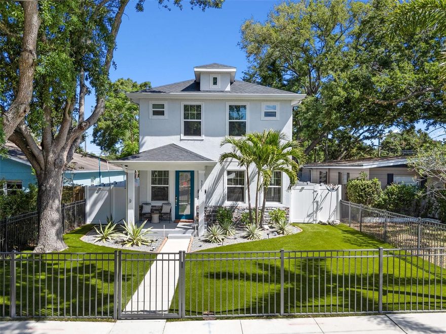 Welcome to 5311 7th Ave N, a 2019-built masterpiece situated in a prime, "high and dry" non-flood zone. This exceptional home offers three bedrooms, two and a half baths, and a dedicated bonus office, providing the perfect private workspace. The crown jewel of this residence is a spectacular, recently added 2025 custom heated saltwater pool and spa that elevates outdoor living to an entirely new level!

Exuding effortless curb appeal, the front of the home is framed by mature landscaping, low-maintenance turf, a fully gated front yard, and a charming covered porch. Beyond the foyer, a thoughtfully designed open-concept floor plan seamlessly connects the spacious living and dining areas, creating a bright and inviting atmosphere perfect for hosting. The gourmet Chef’s kitchen is a true standout, featuring elegant granite countertops, premium 2024 stainless steel appliances, and timeless white cabinetry accented by glass-front showcase shelving and under-cabinet LED lighting. The oversized central island offers breakfast bar seating and is equipped with a professional-grade stainless steel workstation sink. A stylish powder room with marble countertops is also located on the main level for guest convenience.

Upstairs, the primary suite is a true sanctuary, featuring tray ceilings, a generous walk-in closet, and a spa-inspired ensuite with marble countertops, dual sinks, a stunning soaking tub, and a glass-enclosed rain shower. The guest bedrooms are equally impressive, sharing a well-appointed Jack-and-Jill bathroom also finished with marble countertops and dual sinks. A conveniently located laundry closet with a stacked washer and dryer rounds out the upper level.

Step outside into your own private tropical compound. Fully enclosed by white vinyl privacy fencing, the backyard is an entertainer's paradise. An expansive Ivory Travertine patio provides a massive footprint for grilling and outdoor dining, while lush tropical palms and premium low-maintenance turf create a vibrant, "always-green" oasis. Whether you’re tanning on the Baja sun shelf, complete with bubbling fountains and an umbrella holder, or relaxing in the elevated spillover spa, the stay-cool surface underfoot ensures total comfort under the Florida sun.

The backyard transitions seamlessly to an oversized concrete parking pad with alley access. Located just ten minutes from the energy of Downtown St. Pete and the beautiful Gulf beaches, this turnkey home offers the ultimate low maintenance single-family home lifestyle. Start living your dream Florida vacation today!