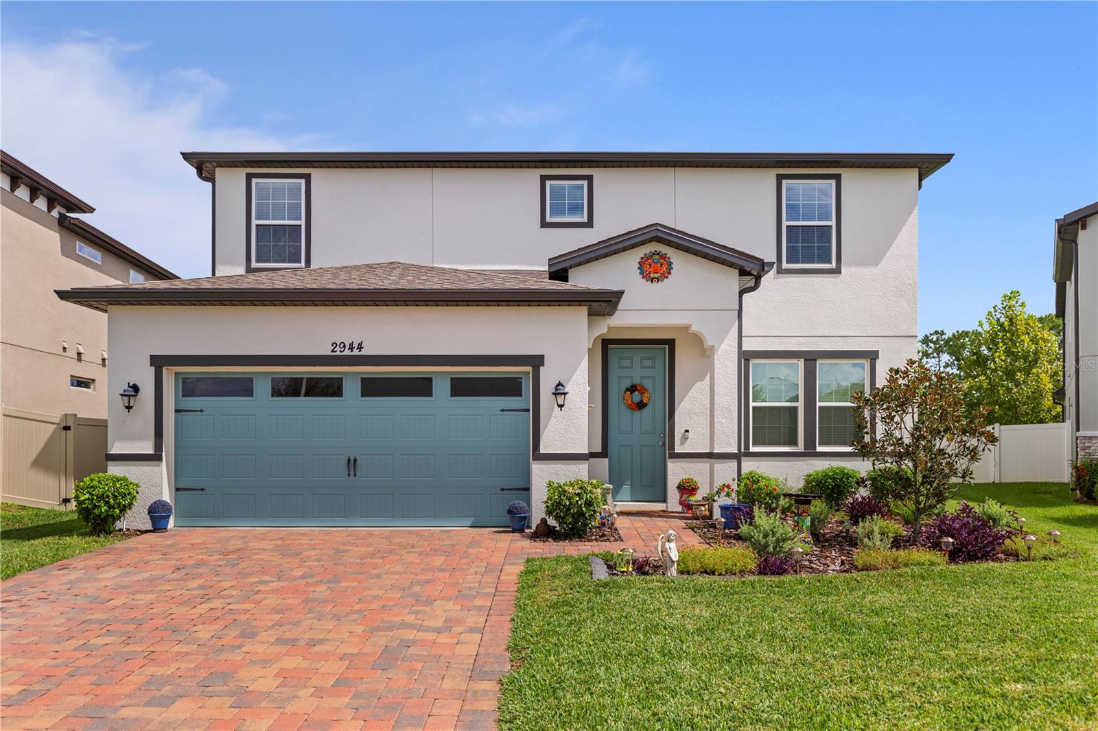 Welcome to 2944 Scarlett Drive in the desirable Oakley Place community of Saint Cloud, Florida! This beautifully appointed two-story single-family residence, built in 2021, combines modern comfort, thoughtful upgrades, and scenic backyard with view of a beautiful pond to create a truly one-of-a-kind home. Offering 4 spacious bedrooms, 3.5 bathrooms, a Den behind French Doors (currently being used as a craft room), and a Second Floor Loft, the 3,000+ square feet of living space will give you plenty of room to spread out. Step inside and immediately notice the care and detail that went into every finish. The entry leads into an open-concept layout highlighted by engineered hardwood floors throughout the downstairs and custom design touches such as shiplap in the mudroom and wrought iron spindle railings on the staircase. The living and dining areas flow effortlessly into the kitchen, creating a welcoming environment for gatherings both large and small.
The chef’s kitchen is a true showpiece. Featuring quartz countertops, pendant lights, stainless steel appliances, a double under-mount sink, pull-out Rev-a-Shelf cabinetry for pots and pans, and a closet pantry, it blends style with functionality. The centerpiece is the four-door flex glass-panel refrigerator (just one year old), offering a modern upgrade. The attention to storage continues with a clever under-stair closet and cabinetry with shelving in the laundry room, keeping your home both stylish and organized.
Upstairs, the thoughtful floor plan includes a Jack-and-Jill bathroom with a walk-in shower, spacious secondary bedrooms, and a luxurious primary suite. Throughout the home, you’ll find ceiling fans in every room for comfort and energy efficiency. Bathrooms showcase upgraded finishes such as a custom vanity with butcher block top and raised vessel sink and another with a marble countertop and vessel sink, adding boutique style to everyday living.
The outdoor spaces make this home truly stand out. The backyard is a private retreat, bordered by a two-tone PVC fence that spans 90+ feet wide at the rear with two gated entries. From the yard, enjoy serene views of a farmer’s field with cows, trees, and even the occasional turkey—a peaceful and unique backdrop rarely found in suburban neighborhoods. Entertain under the pergola set on pavers, or relax on the screened-in lanai with paver flooring, ceiling fan, and hanging lighting. The yard is further enhanced by solar lights on the fence posts, creating a warm evening ambiance.
Practical upgrades extend to the exterior as well. The paver driveway leads to a two-car garage with epoxy flooring and ceiling-mounted hanging storage, maximizing both durability and space. The home is also equipped with irrigation, durable block/stucco construction, and a shingle roof for peace of mind.
Located in the sought-after Oakley Place subdivision, this home offers not just a residence, but a lifestyle. The community is conveniently close to major highways, shopping, dining, and excellent schools, all while providing a tranquil environment away from the bustle of the city.
With its blend of modern features, custom upgrades, and stunning outdoor living spaces, 2944 Scarlett Drive is move-in ready and waiting for its next owner to call it home. Don’t miss your chance to experience the perfect balance of elegance and everyday comfort—schedule your private showing today!