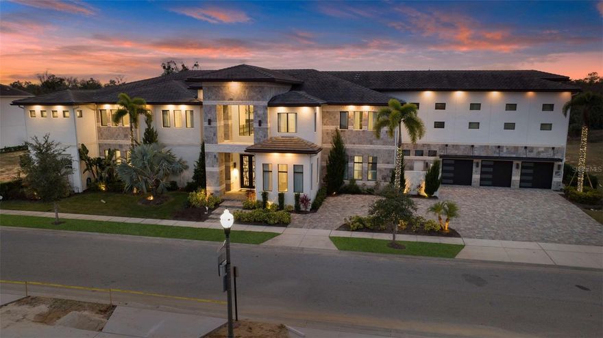 Welcome to 1148 Grand Traverse Pkwy, a stunning 21,397 sq. ft. estate that redefines the meaning of luxury living. This extraordinary 16-bedroom, 18-bathroom home comfortably accommodates up to 36 guests, making it the ultimate destination for family reunions, group retreats, milestone celebrations, or even your dream home for gatherings with family and friends. With its unparalleled amenities and contemporary design, this property is a premier vacation rental with a proven track record of success.
Upon entering this magnificent property, you are greeted by grand interiors with high-end finishes, expansive living spaces, and the ultimate resort living experience Florida has to offer. The chef’s kitchen is a culinary masterpiece, featuring top-of-the-line appliances, stunning stone countertops, a large island for preparing gourmet meals, and an impressive two commercial-sized refrigerators and freezers. The walk-in pantry and seating for 12 provide everything you need for entertaining in style. The adjacent dining area seats 20, creating the perfect setting for shared meals and unforgettable moments. Each of the 16 bedrooms serves as a private retreat, complete with luxurious finishes and spa-inspired en-suite bathrooms. The themed bedroom, inspired by Star Wars, is a showstopper, with a total of 12 bunks and a loft gaming area sure to captivate young adventurers.
1148 Grand Traverse Pkwy is an entertainer’s dream, offering an unmatched array of amenities for both relaxation and fun. The home features a dedicated spa room with a sauna, a state-of-the-art in-home gym for fitness enthusiasts, and a professional-grade golf simulator for those looking to perfect their swing. For sports lovers, there is a ½ court basketball court, while the arcade/game room will provide hours of entertainment with its 2-lane bowling alley, complete with bowling shoes in all sizes for a truly fun-filled experience. Movie lovers will delight in the private theater room, which seats 12 and offers the ultimate cinematic experience.
The outdoor living area is truly a highlight of this exceptional estate. The expansive back patio is equipped with a summer kitchen, perfect for preparing meals and dining al fresco. Numerous seating areas provide space for relaxation, while the hot tub, pool, water slide, and winding lazy river offer endless enjoyment. Whether you are lounging by the pool or enjoying a meal under the stars, the outdoor space at 1148 Grand Traverse Pkwy offers the perfect balance of luxury, leisure, and entertainment.
Reunion Resort is a luxurious vacation destination located near all that Central Florida is famous for and just a few miles from Walt Disney World. Along with 3 signature championship level golf courses designed by golf legends Jack Nicklaus, Tom Watson & Arnold Palmer, you'll enjoy a variety of restaurants from fine dining to more casual options along with poolside bars and coffee shops to start your day while never having to leave the resort. Additionally, there are multiple pools, onsite water park, kid's play areas, tennis, picklelball, fitness center & more.
