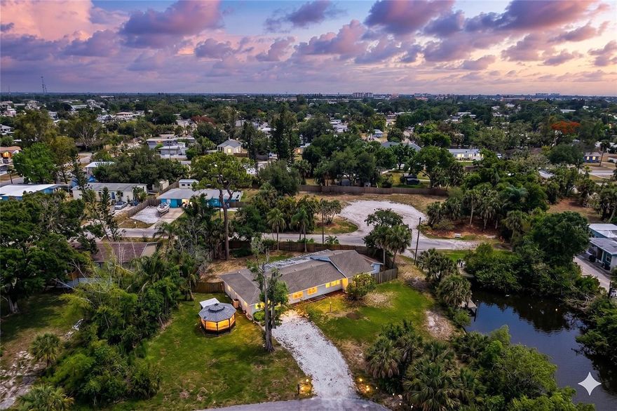 One or more photo(s) has been virtually staged. SUNSET VIEWS and a great DEAL! **ONE OF A KIND** oversized property directly on the Intracoastal Waterway in Nokomis Florida. No HOA. No CDD. No Limitations. Front of house faces west, offering endless sunsets every night.
Loreto Court (County) Bay Access is located on the adjacent street. Very quiet, well manicured , county access for you and your kayak! This "Old Florida" gem in Nokomis is a rare find, offering a quintessential coastal lifestyle at an absolute STEAL of a price. Situated on a lush 12,000-square-foot lot this property provides the freedom to house your boat, RV, and even chickens, all while being steps away from a County-maintained BOAT RAMP and seawall. The main 3-bedroom, 2-bathroom residence exudes vintage character with old-world look tile and a cottage-style kitchen, complemented by a detached "gazebo-style" GUEST SUITE that is perfect for rental income or a private home office. While the home is a solid candidate for a creative renovation or a spectacular stilted rebuild to maximize those VIEWS OF SHAKETT CREEK & DONA Bay, the heavy lifting has already been done with a newer roof, septic system, and electrical panel (all 2018), plus a raised HVAC and generator hookup for total peace of mind. Whether you're enjoying sunsets, enjoying the massive SCREENED LANAI, or biking the nearby Legacy Trail to Nokomis Beach, this property represents a phenomenal deal for anyone looking to secure a high-potential slice of the Gulf Coast without the waterfront taxes.