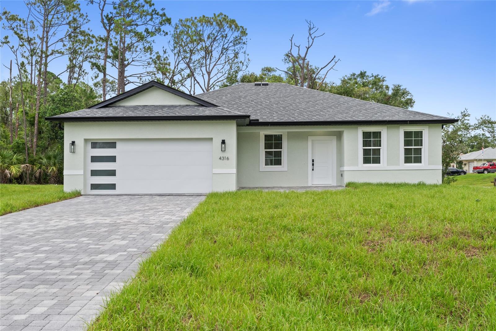 Under Construction. Home is fully completed, pending final inspection for Certificate of Occupancy. THIS PROPERTY QUALIFIES FOR CLOSING COSTS ASSISTANCE PLUS AN ADDITIONAL 1% INCENTIVE WHEN USING BUILDER’S PREFERRED LENDER
Brand new concrete block construction, corner lot in the heart of North Port — no HOA, no CDD, and no flood zone (X). This beautifully crafted 4-bedroom, 3-bathroom home offers an elegant open floor plan with a epoxy finished two-car garage, and premium finishes throughout.
The gourmet kitchen features a large center island with waterfall-edge quartz countertops on both sides, soft-close cabinetry, stainless steel Samsung appliances — ideal for entertaining and everyday living. Luxury vinyl plank flooring flows throughout the home, offering style and durability.
The spacious primary suite includes his-and-hers walk-in closets and a bathroom with dual sinks and a glass-enclosed walk-in shower. A secondary bedroom includes a private en-suite bath, and a walk-in closet perfect for guests or multi-generational living. All bedrooms with blinds and modern celling fans.
Additional features include impact-resistant windows and doors, a smart thermostat, upgraded lighting, a water filtration system, and garage doors with glass panels that allow natural light in. Enjoy Florida living year-round on the covered lanai with a nicely sized backyard and extended paver driveway.
Easy access to I-75, commuting to Sarasota, Fort Myers, and top-rated Gulf Coast beaches like Siesta Key and Venice Beach. An excellent opportunity for homeowners and investors alike!
Schedule your private showing today!