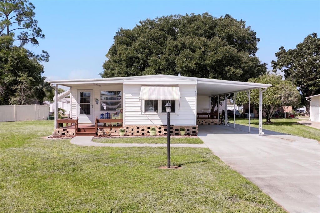 Photo of 914 Blue Heron Boulevard, Osteen, FL 32764 (MLS # O6451534)