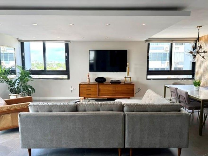 Enjoy this beautiful, modern  and completely remodeled corner apartment. Everything is done to move in. The property includes 2 bedrooms, 2  beautiful remodelled bathrooms with italian cabinets,  a very spacious living and dining area, a beautiful opened kitchen remodeled with italian  cabinets and equipped with excellent stainless steel appliances , dry bar  with italian cabinet and balcony. The apartment has porcelain tiles, ceiling fascias in kitchen, living and dining areas  among other beautiful extras. Direct view to  San Jose Lagoon from the balcony  and side view to Isla Verde Beach form the rest of the property.  The condominium has an elegant remodeled lobby,  24-hour security with a guard and controlled access, a  beachfront swimming pool and direct access to Isla Verde Beach. The apartment does not have parking space, but Seller have one rented that will be included and paid for one year. Also the building has water cistern and generator for common areas and coming soon a new Full Generator for the whole building.  The property conveniently  located very close to supermarket, excellent restaurants, pharmacy, many convenient stores, services and direct access to avenue and highway.