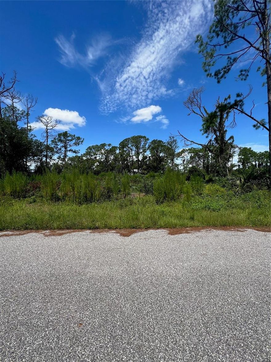 Vacant lot 10,755 sq ft for sale in North Port. All surveys complete, plans for 2500 sq ft house with 1892 sq ft of living space already drawn and placed on property ready for permitting. Septic permit as well, just needs to be renewed. Build a beautiful home in this rapidly growing area of Sarasota County. Wellen Park and Cool Today Park nearby.