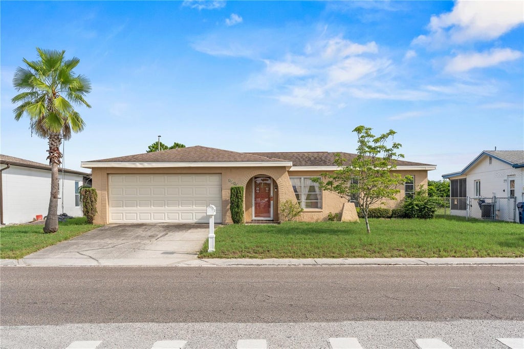 Photo of 8351 Fox Hollow Drive, Port Richey, FL 34668 (MLS # TB8546913)