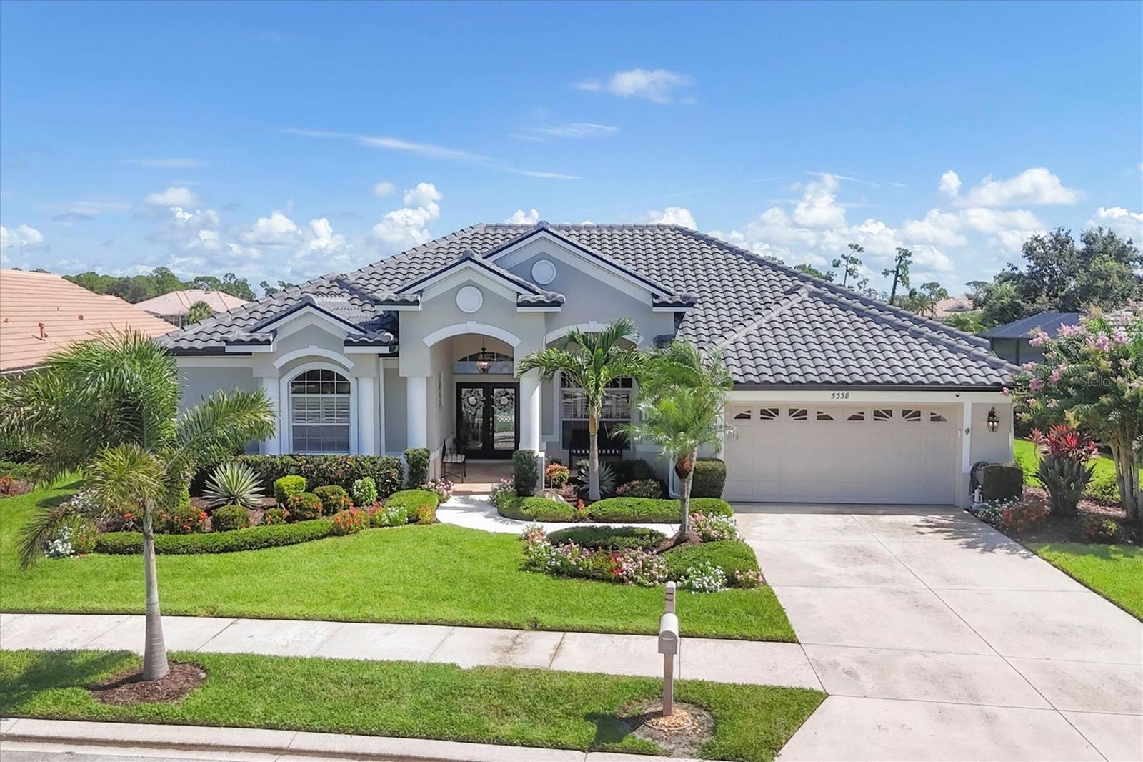 HERON CREEK GOLF & CC * UPDATED * 3BED 3BATH+ DEN POOL/SPA *STUNNING GOLF WATER & GOLF VIEW! Why wait to build when you can enjoy fresh, modern living in one of the area’s most sought-after established communities? Located in Heron Creek Golf & CC, just steps from the clubhouse this home blends elevated design, casual elegance, & a coveted golf-and-lake setting. With 3 bedrooms, 3 baths, office (opt 4th bed), living room, dining room, family room & thoughtfully redefined layout, this home delivers both style a& substance. The owner’s created a custom home feel by removing a wall to open the home’s flow & create a light, expansive interior with exceptional functionality. The stunning new kitchen is the heart of the home, featuring a large quartz island, tall light wood cabinetry with soft-close doors & drawers w/custom pullouts, new SS appliances incl: a double oven NATURAL GAS range, & LED lighting. NEW Plank ceramic tile flooring in a soft driftwood hue runs throughout the home. The pleasing neutral color palette in gracious grays, white cloud & sand tones blend perfectly like a restful day in paradise! Refined architectural details throughout including classic crown molding, plantation shutters, & soaring ceilings elevate the feel of every room. Cascading glass doors & large windows leave this home feeling open & airy and awash in natural light. The spacious great room spills effortlessly onto the resort-style lanai, where a saltwater pool/spa glisten under a new bronze clear-view enclosure. The screen disappears into the sky, creating a seamless backdrop of wide lake & golf course views. Enjoy the well equipped summer kitchen, perfect for outdoor entertainment, or just relax and enjoy a good read after a refreshing swim! A private guest wing is separated from the main living area by a convenient pocket door & includes 2 bedrooms w/ a shared full bath—ideal for visiting friends or extended stays. Both closets have custom-built ins so no need for excess furniture. The primary suite is a serene retreat and features, direct access to the lanai,2 spacious walk-in closets w/ custom built-ins, an ensuite bath w/ a spa-like soaking tub, Roman shower, & a large linen closet. The Office showcases expansive views of water and the 9th hole (Marsh course), with direct lanai access—offering versatility as a guest room or quiet workspace. It also has easy access to the adjacent full bath (Pool Bath) .The large triple pane picture window was replaced and is Impact Rated for peace of mind. You can leave your worries behind because this entire home has been beautifully refreshed, inside & out. Notable Updates Inc: INT/EXT RE-PAINT ,Exquisite designer light fixtures that elevate the foyer & dining space w/ modern flair, lush tropical landscape & front yard lighting, Barrell TILE ROOF (2023), Tankless Water HTR, New whole house AC system & Mini SPLIT for Primary, New glass shower doors , new pool heater, FULL KITCHEN REMODEL, Custom lighting & fans, & Epoxied Garage Floor. Heron Creek offers exceptional amenities including a 21,000 sq ft clubhouse, 27 holes of Championship golf Arthur Hills design, resort style pool & spa, a robust social calendar, fitness center, Tennis courts & formal & casual dining options! *NO CDD FEES * LOW HOA FEES conveniently located w/easy access to I-75 & US-41, Cocoa Plum Shopping , WELLEN PARK, Braves Stadium, COSTCO & just 3 miles to the new 450 Million SMH Hospital Coming to I-75 / Sumter Blvd!